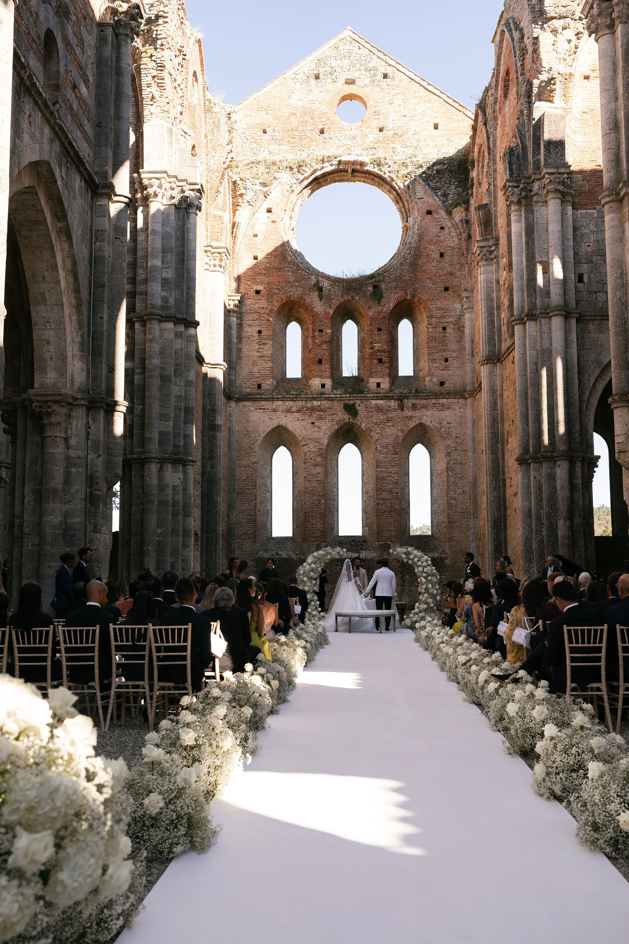 Ginevra and Avi — Abbazia di San Galgano, Tuscany. Destination Wedding Photographers and content creators based in Spain