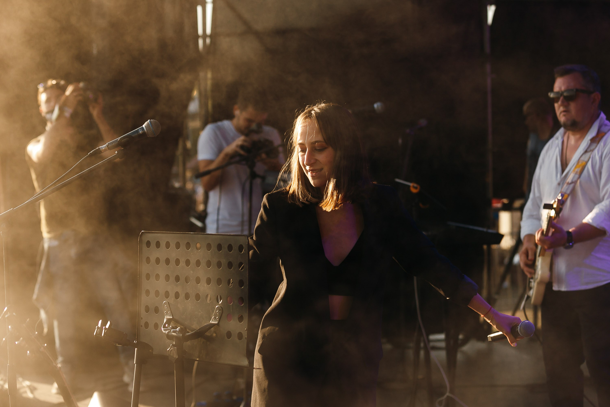 Group of people dancing in club, energetic atmosphere