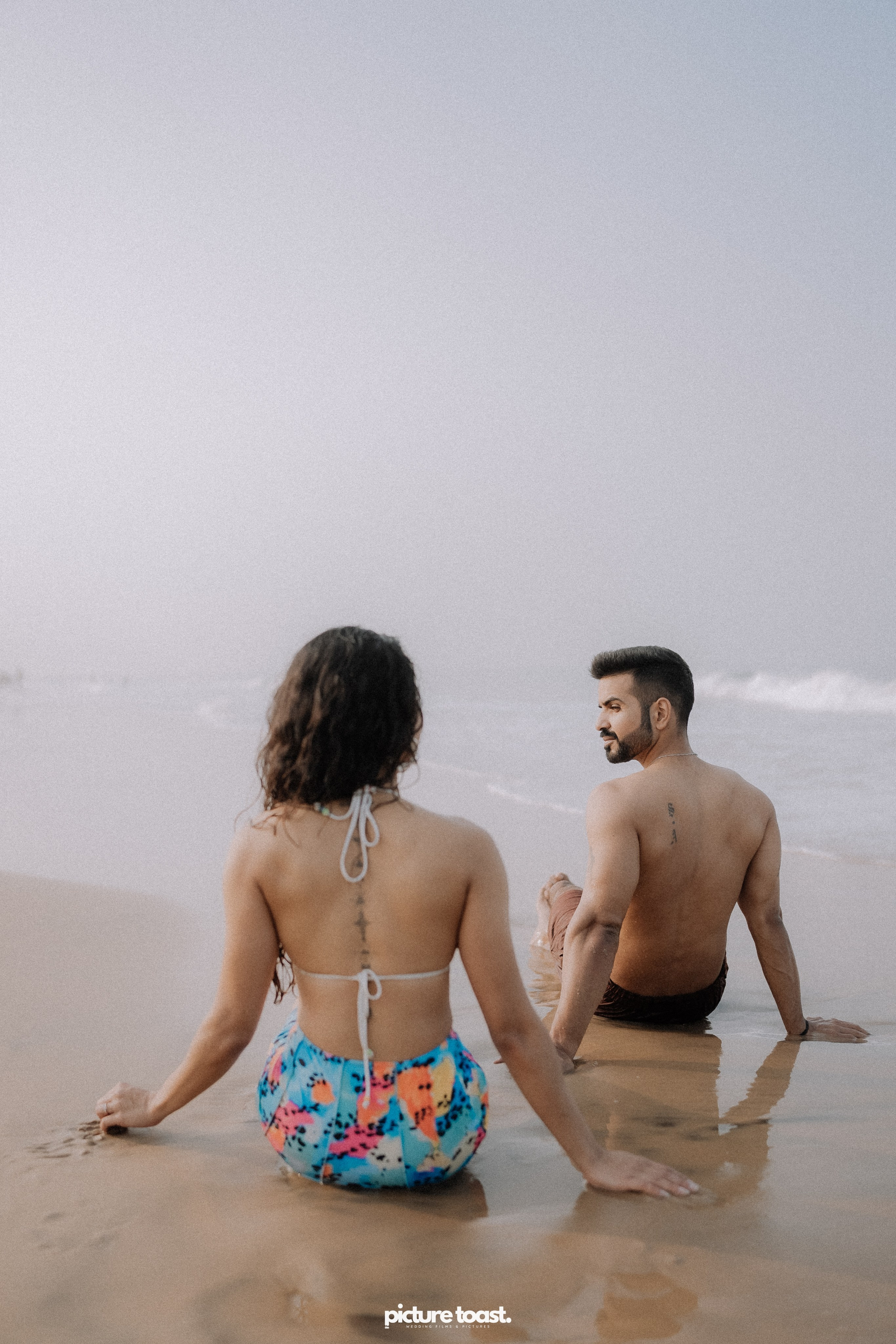 Love In The Beach. Fine art Wedding Photographers in India & Canada