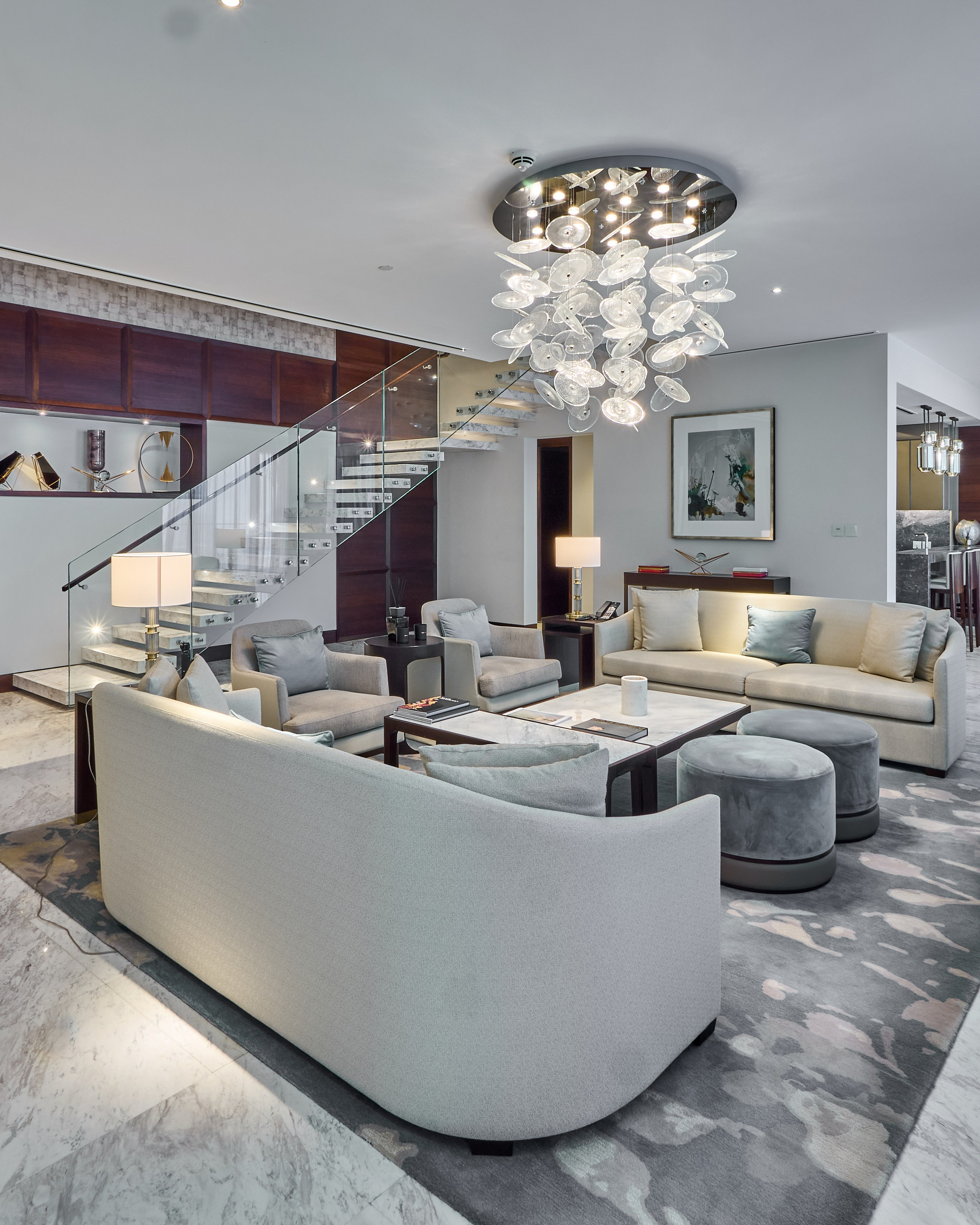 Elegant living room with view of floating staircase in Address Skyview, Dubai. Interior photo for premium property listings and Airbnb.