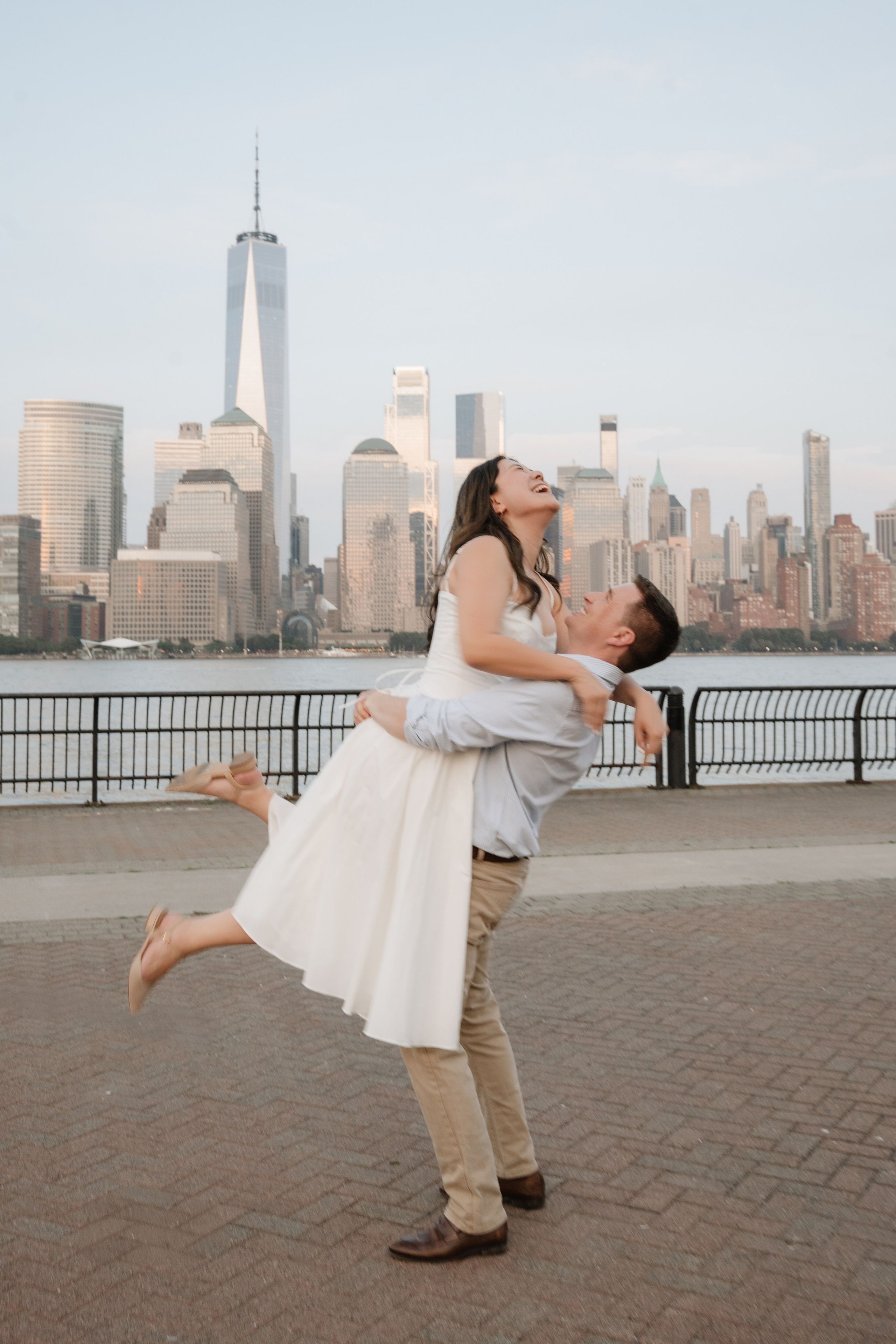 An adorable couple with their dog. Portrait and wedding photographer in New York