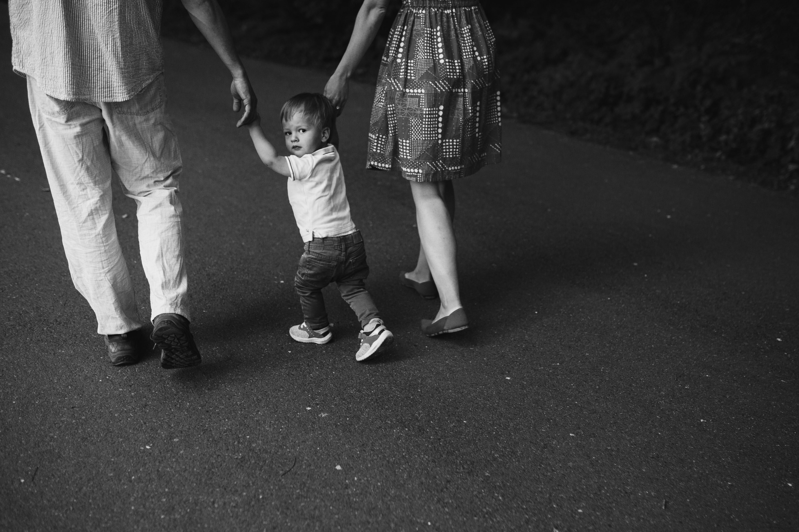 Family walking the park, black and white creative shot
