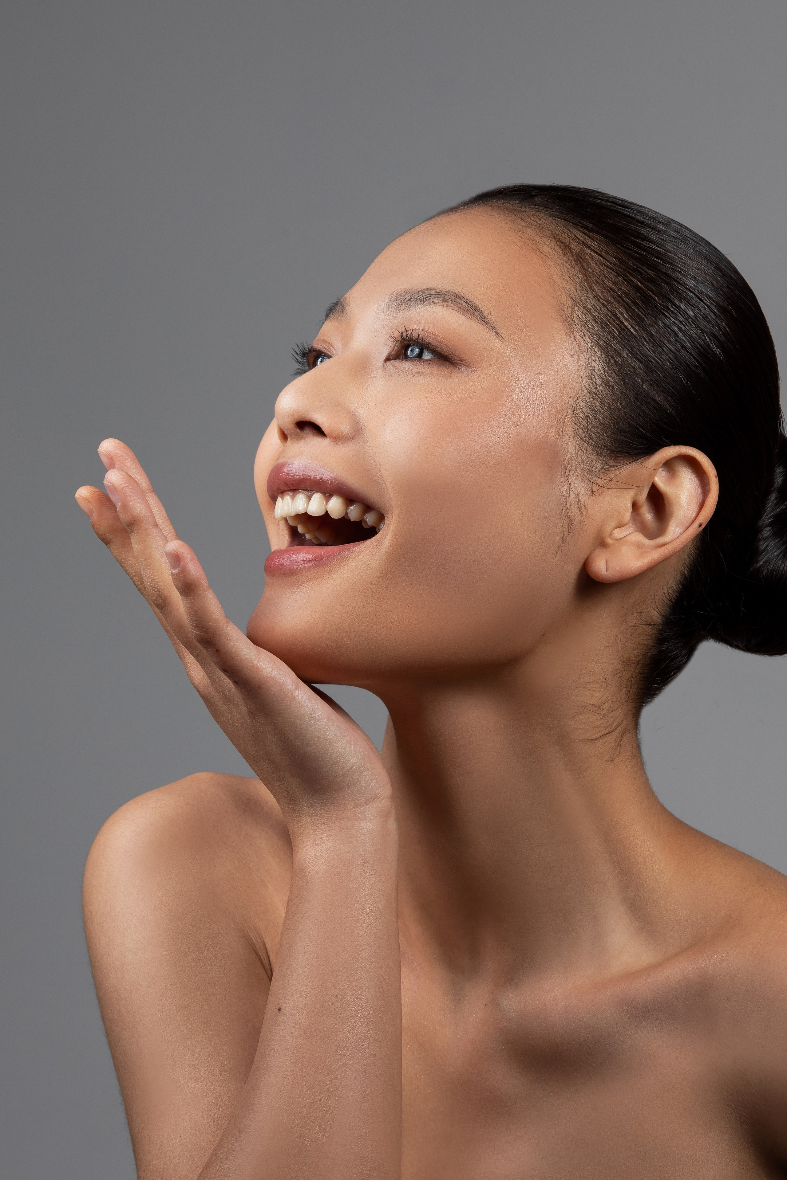 Studio photo shoot, promotional photo shoot for APTOS company in Shanghai. Professional Chinese girl model laughing. 