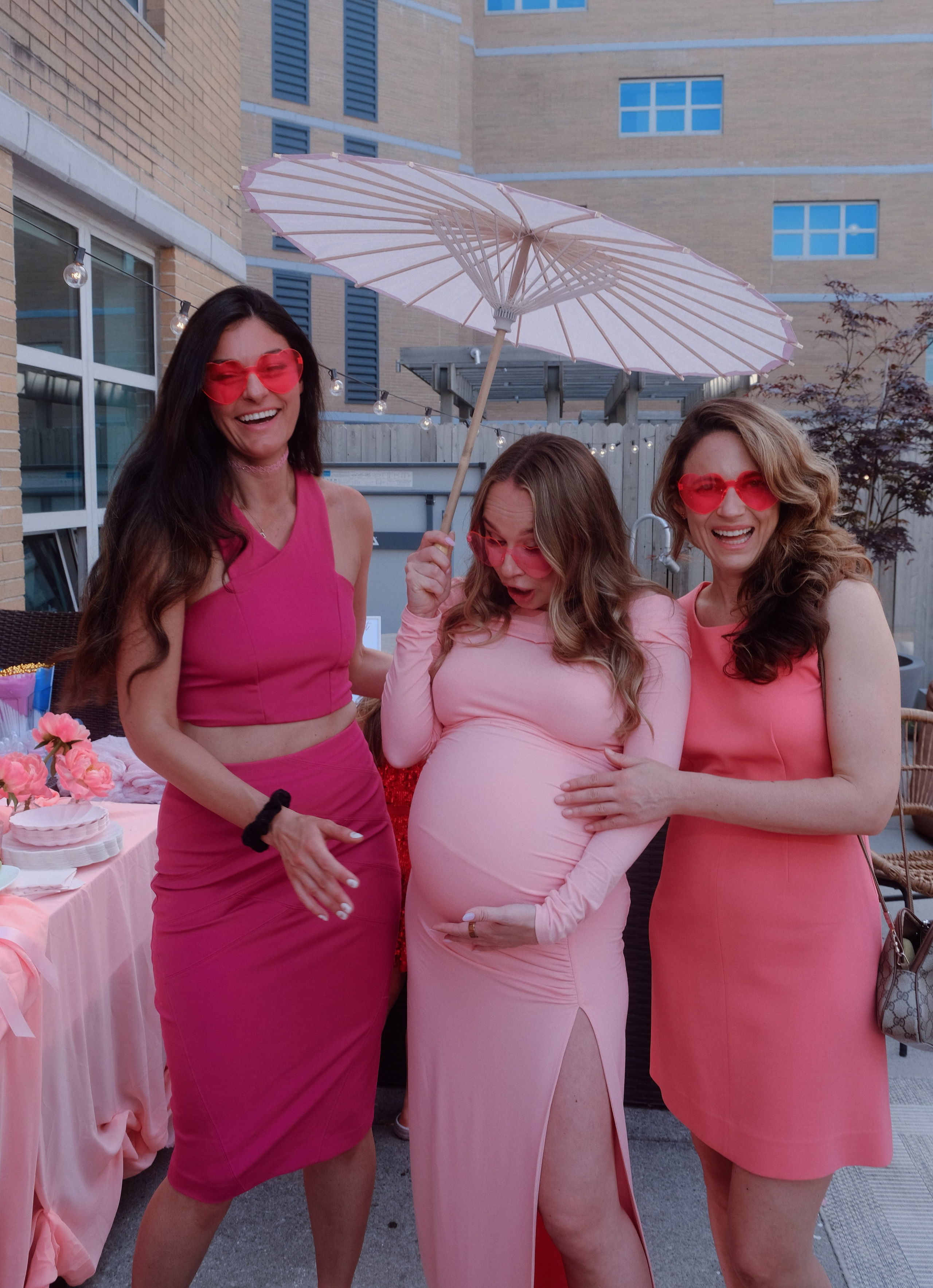 Guests laughing and playing games at the baby shower
