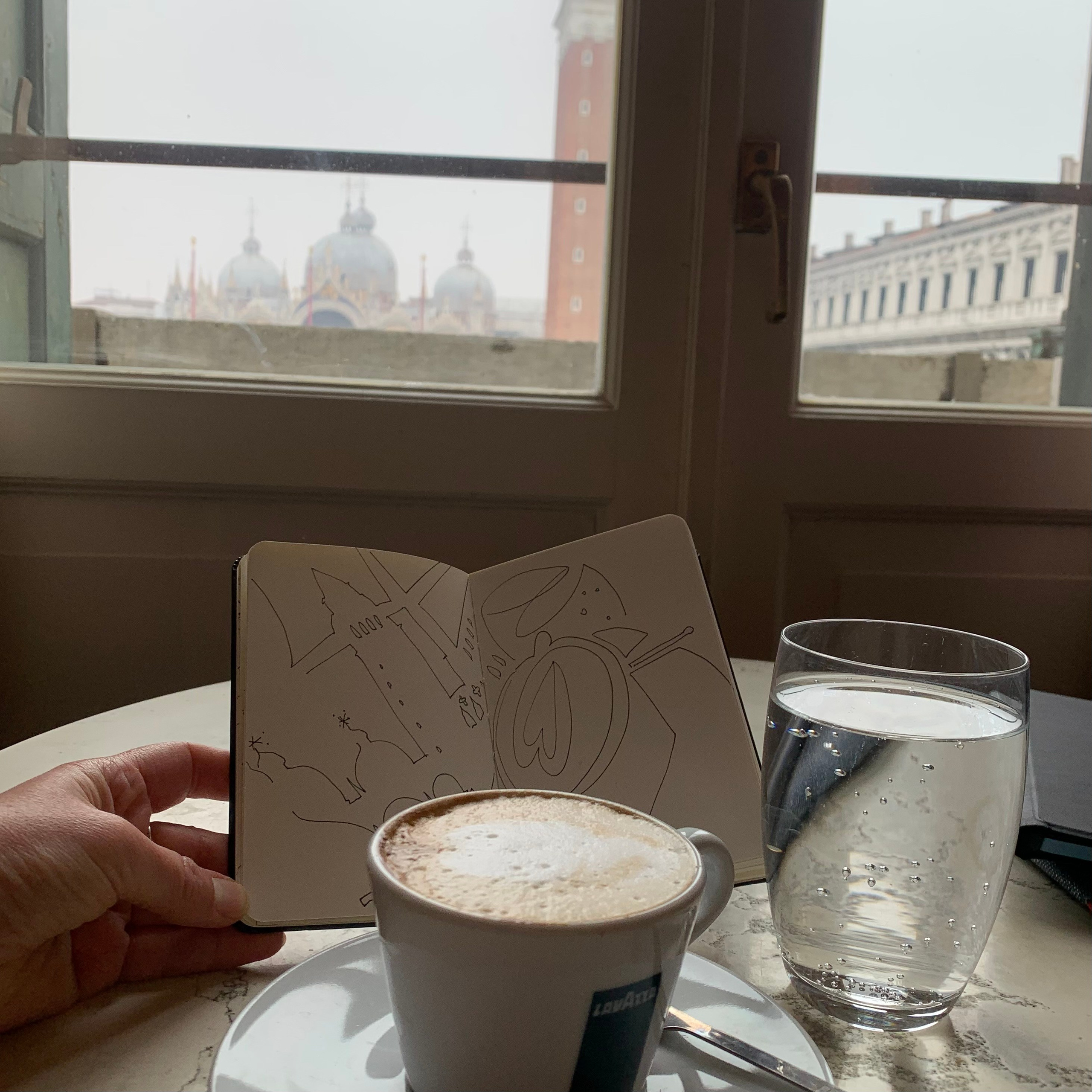 Moleskine notebook with hand-drawn sketches made in Venice, serving as an artist’s visual diary and personal testimony within a contemporary practice. Coffee and drawing practice.