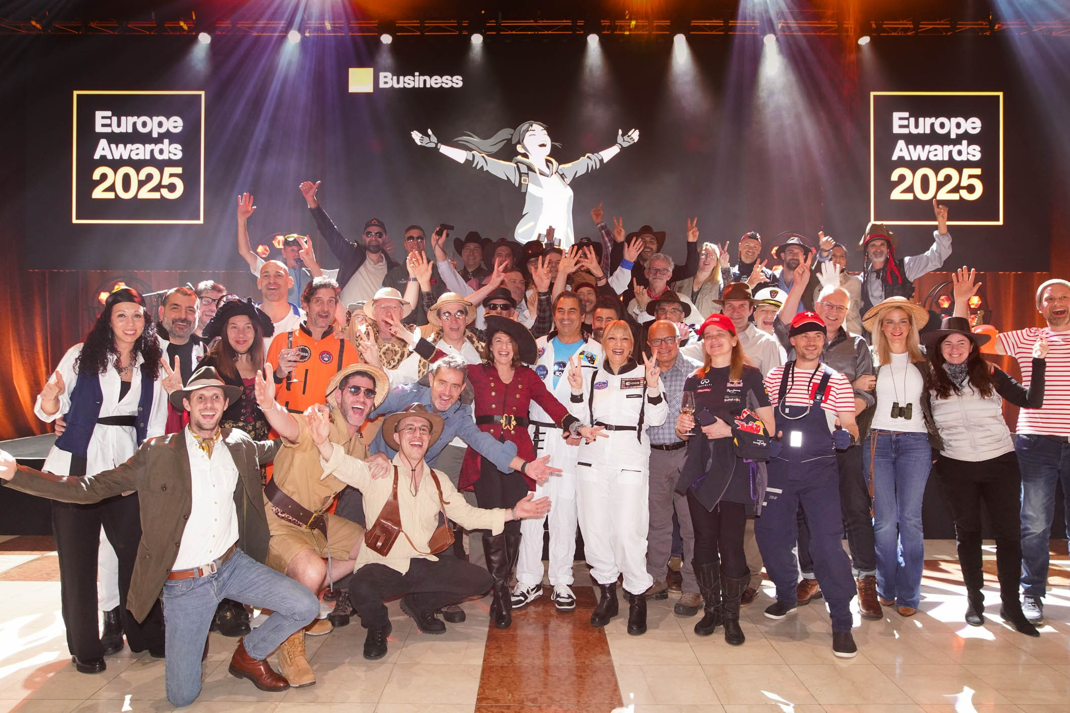 Work colleagues take to the stage for an impromptu photo during a gala event at the Hotel Hilton in Prague.