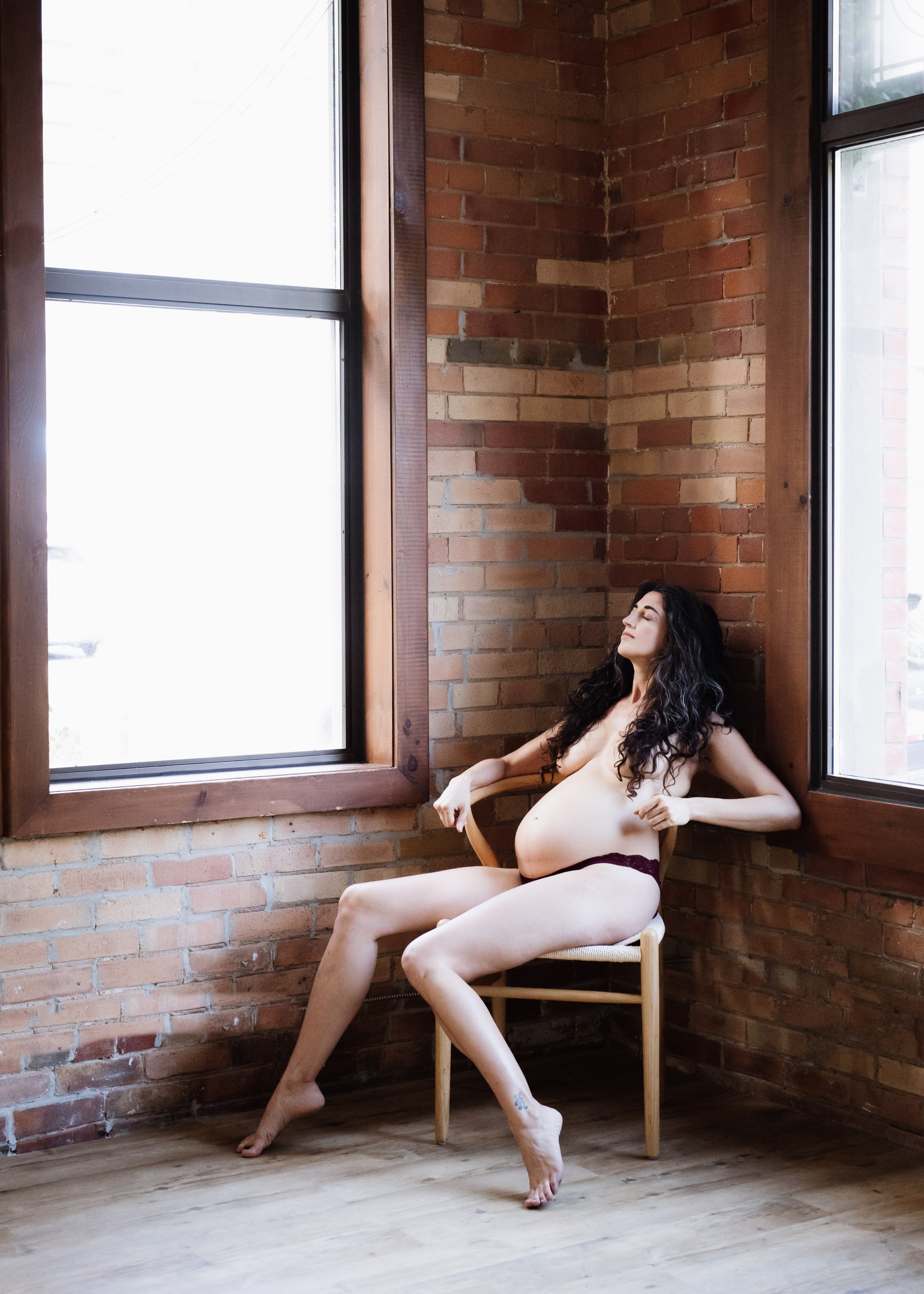 portrait of pregnant topless woman in studio 