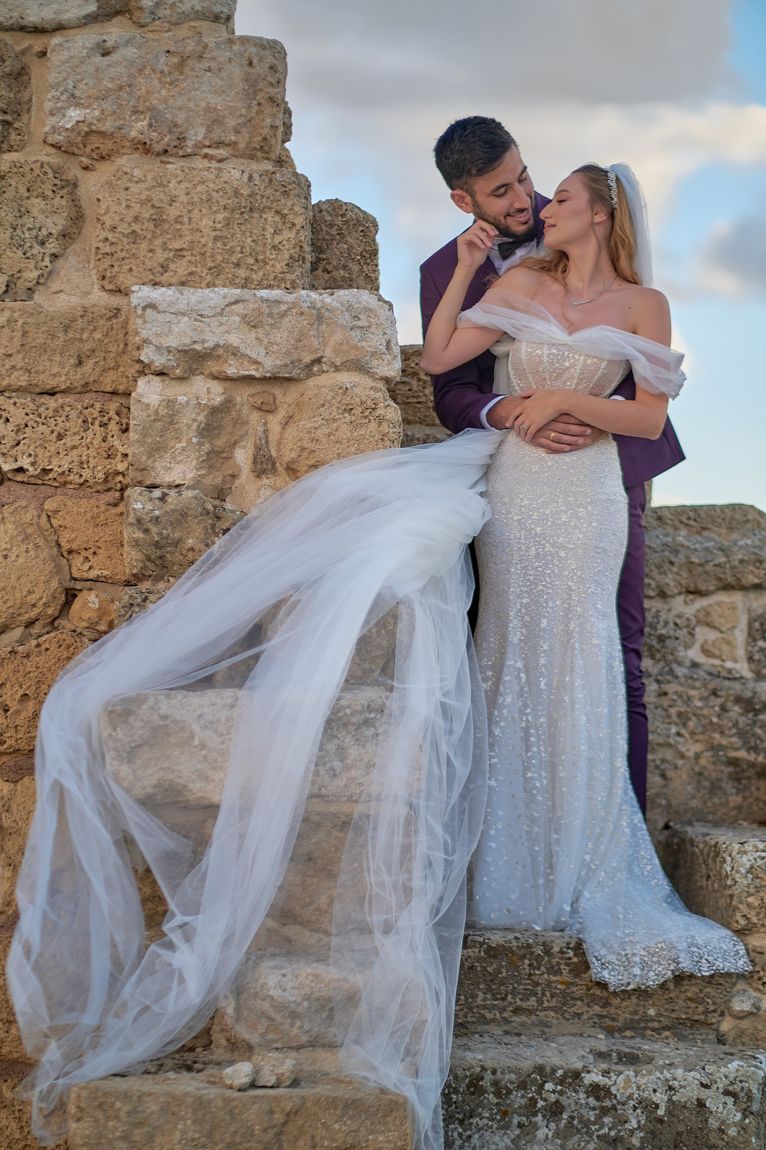 Romantic wedding couple portrait, bride with veil and groom in suit, emotional wedding photography by Maxim Polak Israel