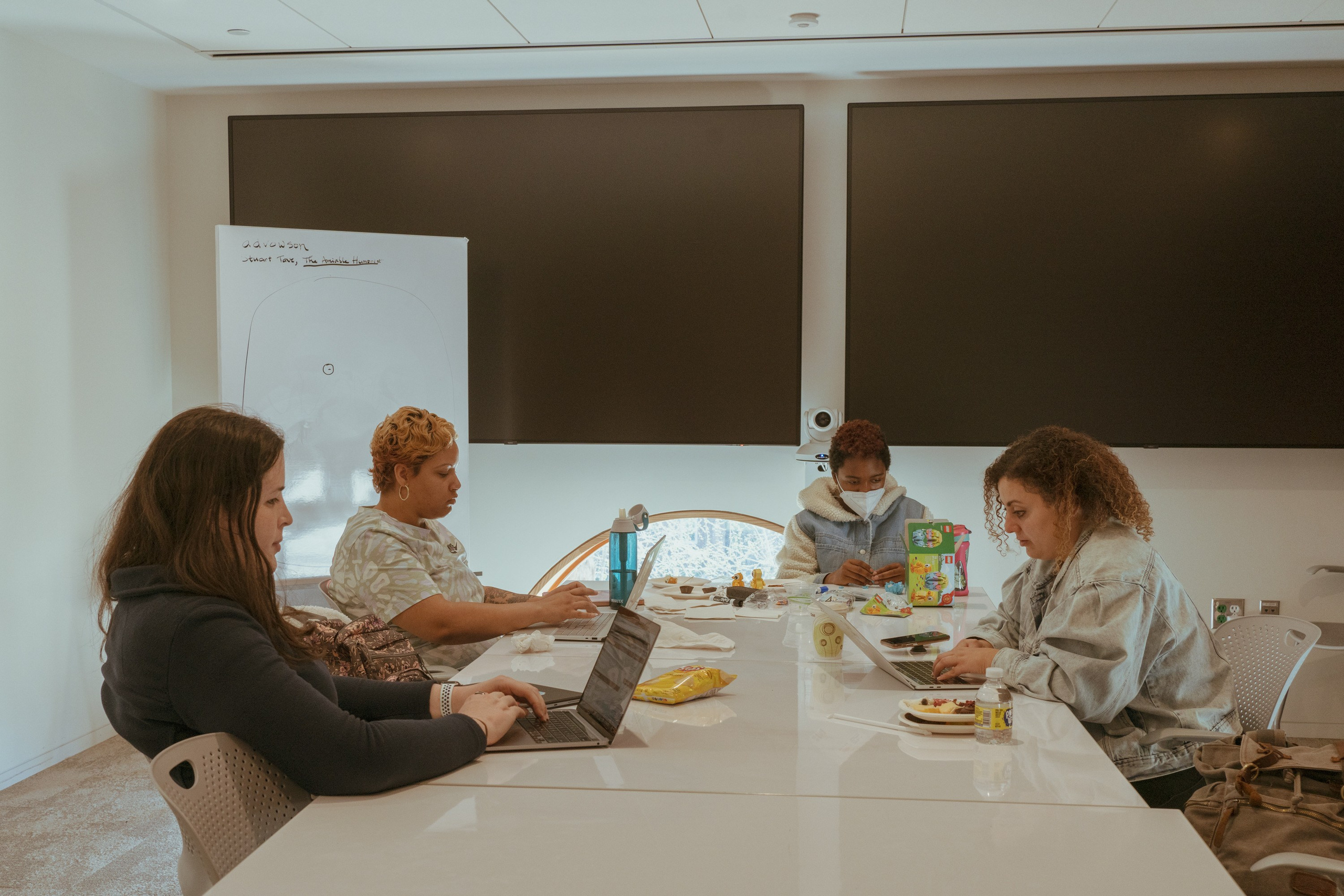 Emy is studying for her finals along with other classmates in the school library. Coco is keeping herself busy with Lego.