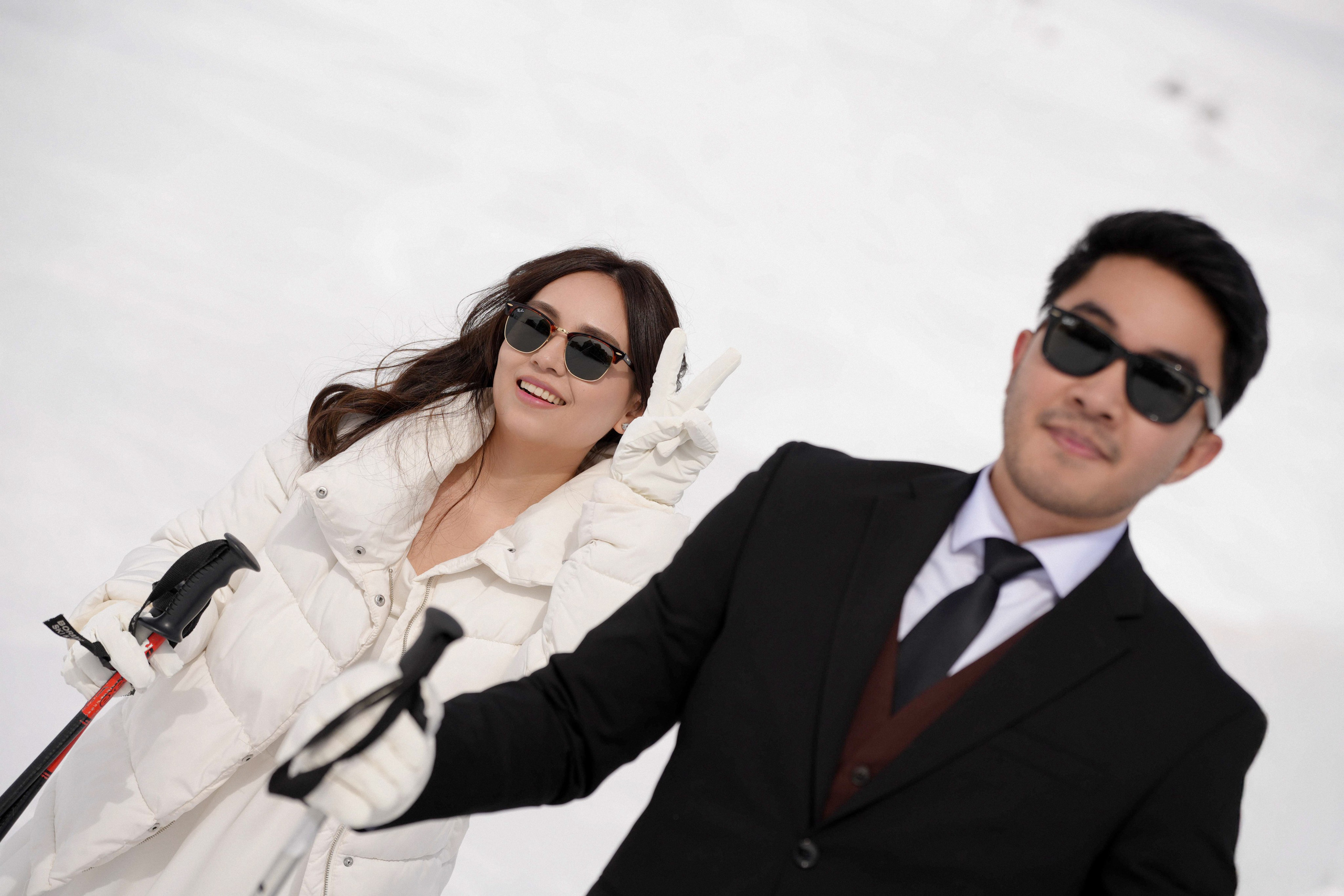 Couple skiing during their engagement shoot 