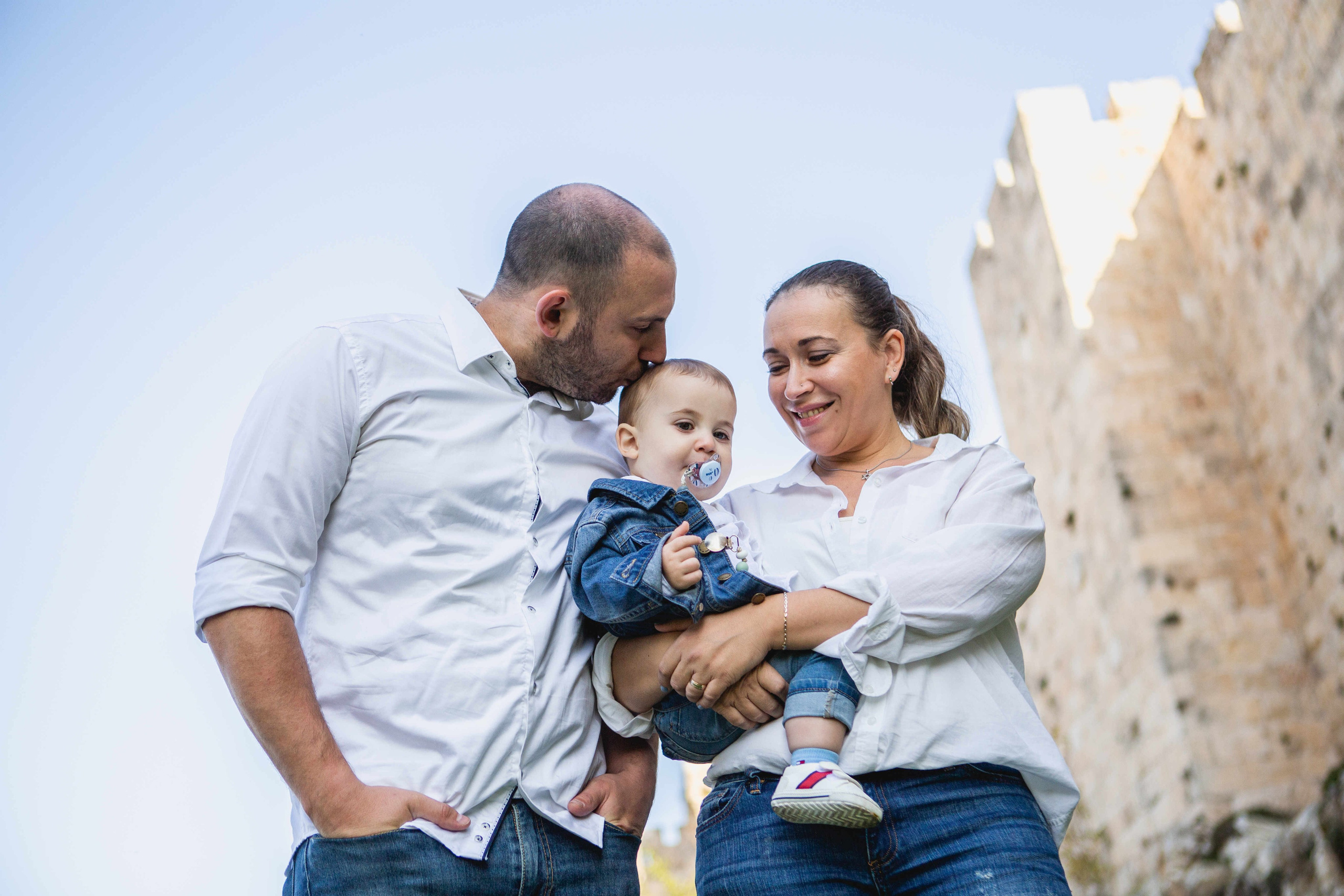 AT THE WALLS OF THE OLD CITY. PHOTOGRAPHER IN ISRAEL