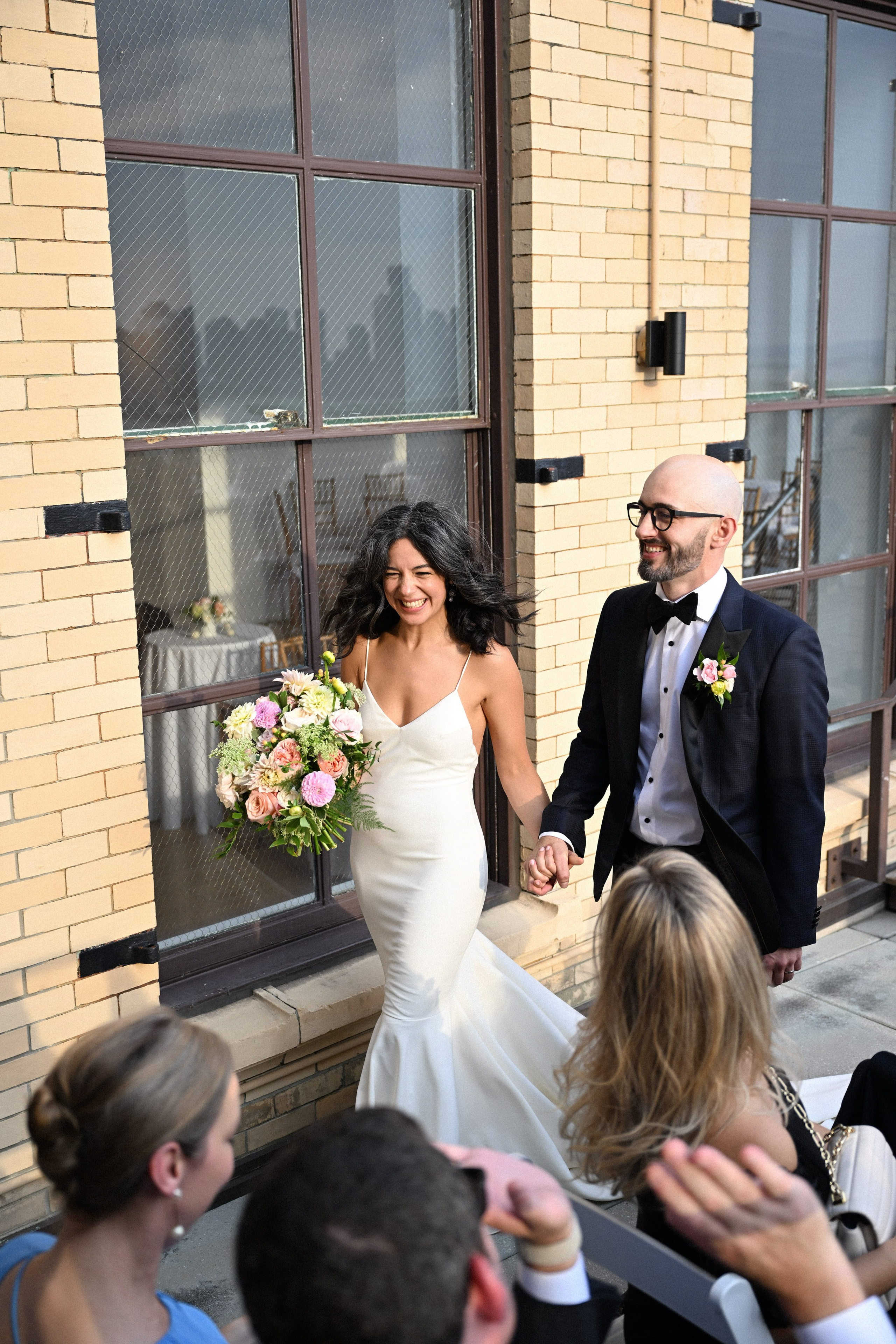 a bride and groom walking down the aisle