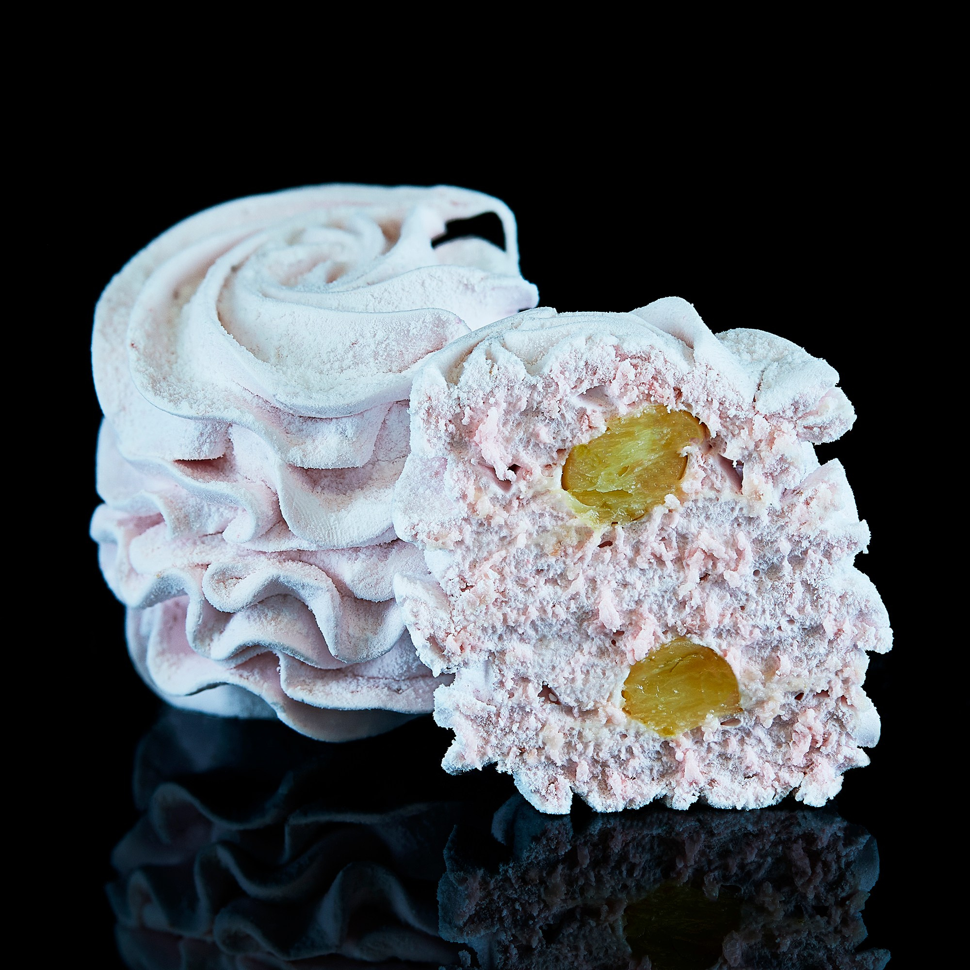 Photographer Roman Djuzev - Sliced ​​Marshmallow on Black Background with Reflection.