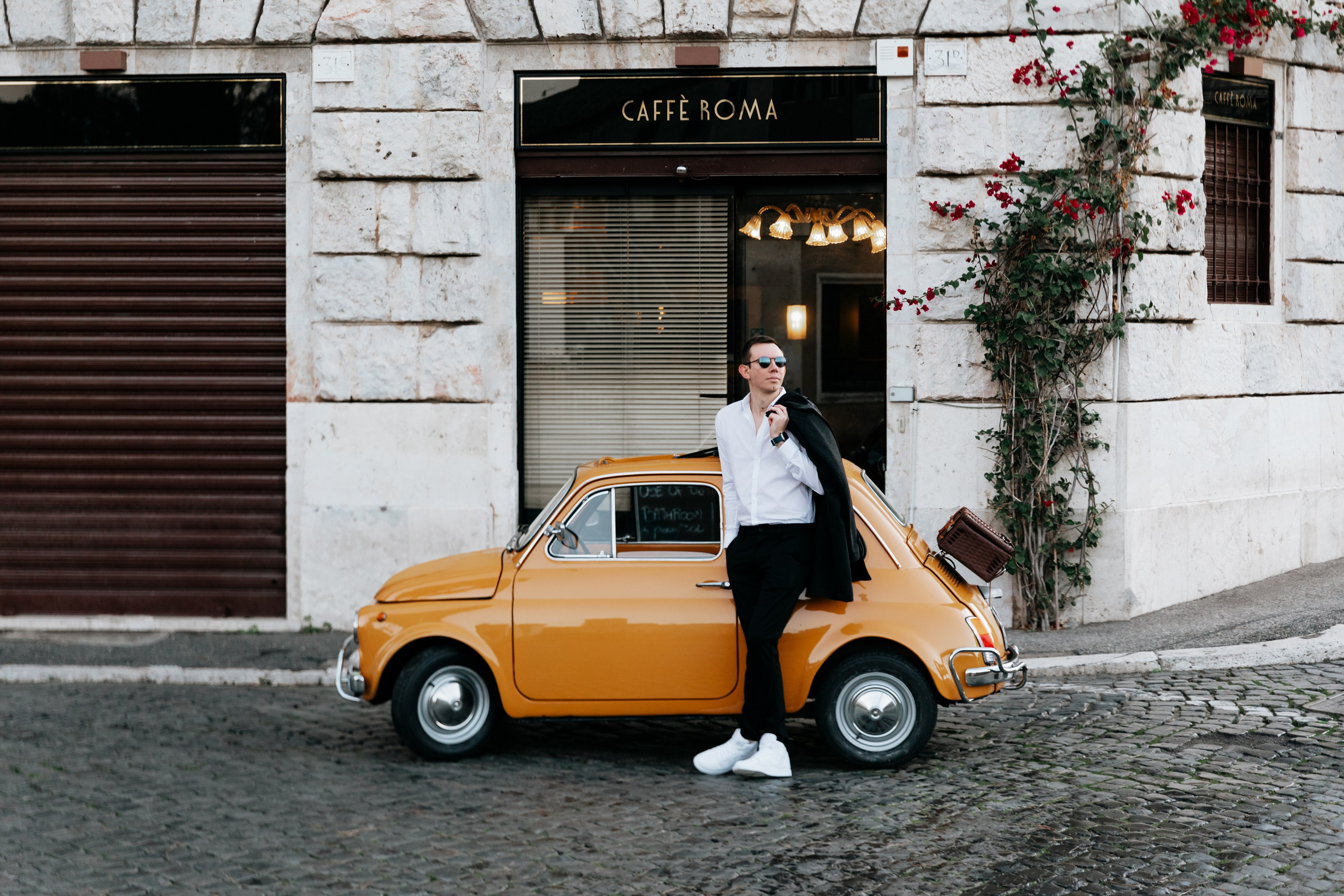 Fiat 500 and Vespa. Photographer in Rome