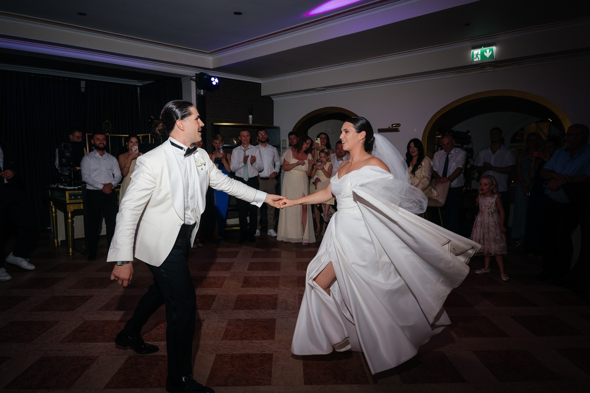 Groom spinning the bride during the first dance