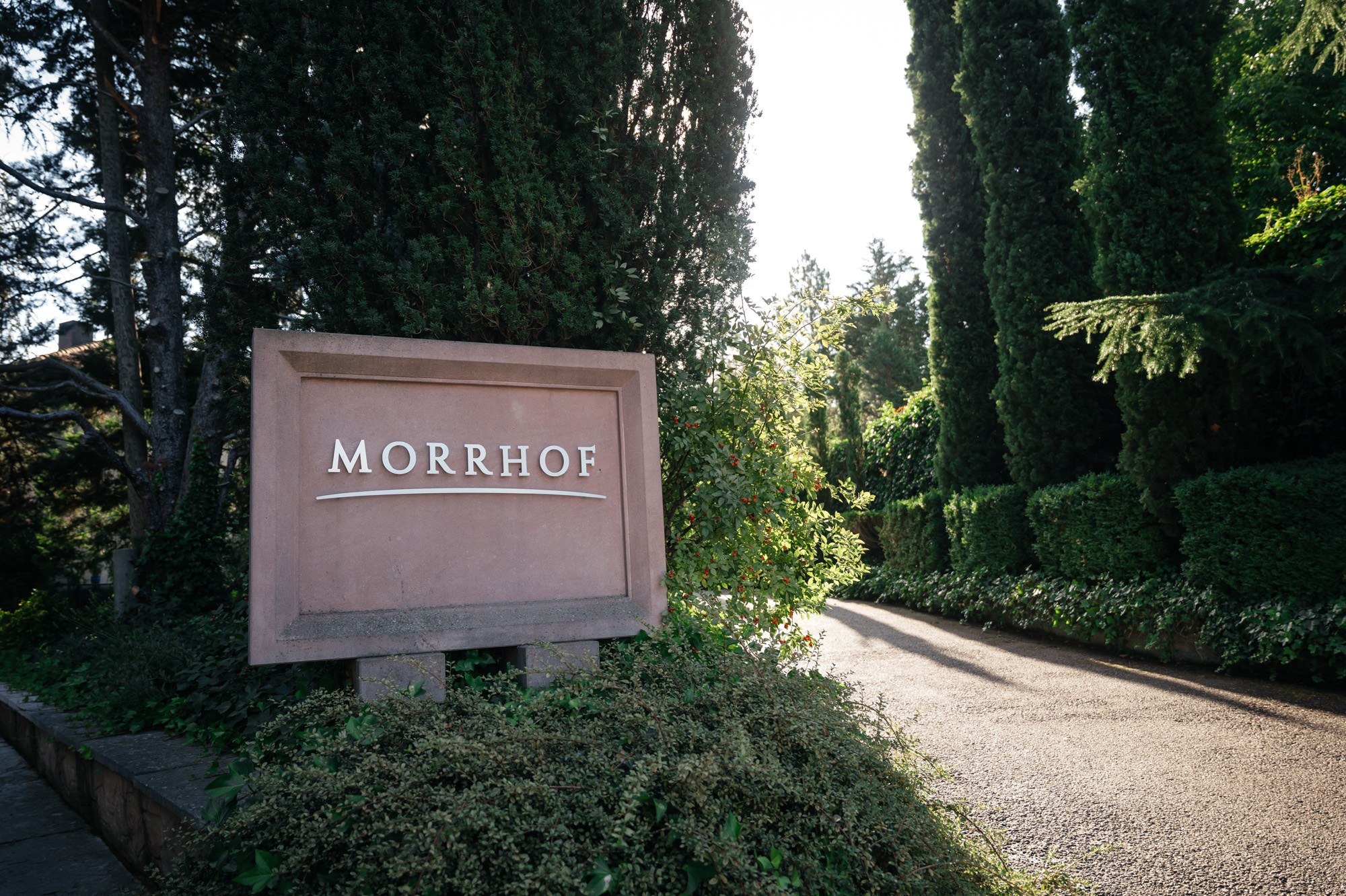 Morrhof entrance sign in Großkarlbach between cypress trees
