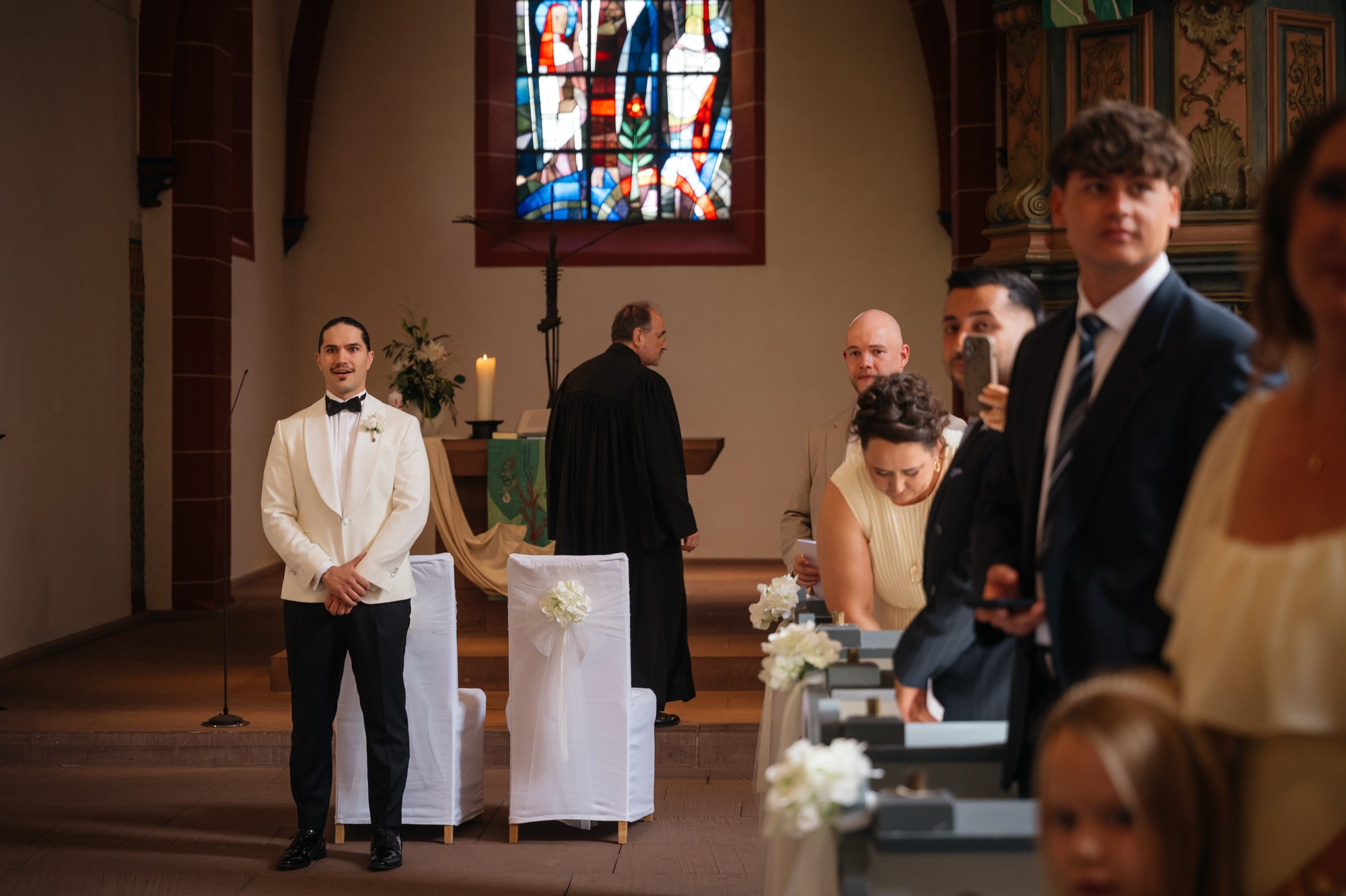 Groom waiting for the bride at the altar
