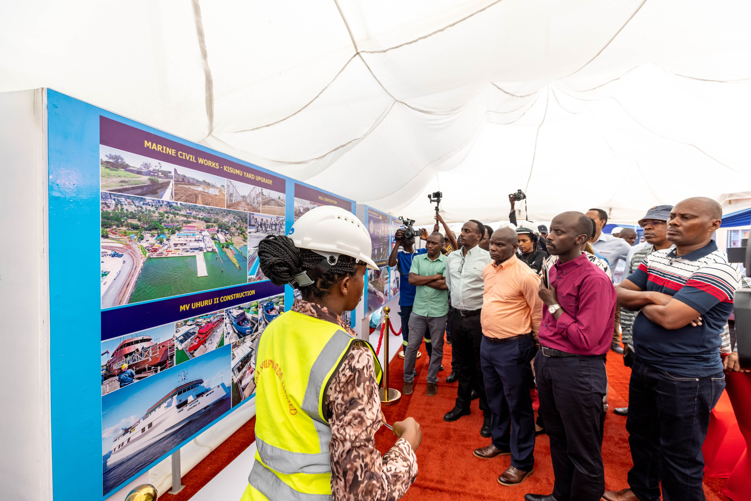 A wide-shot of an exhibitor giving insights to attendees, during Kenya Shipyards exhibition, in Kisumu.