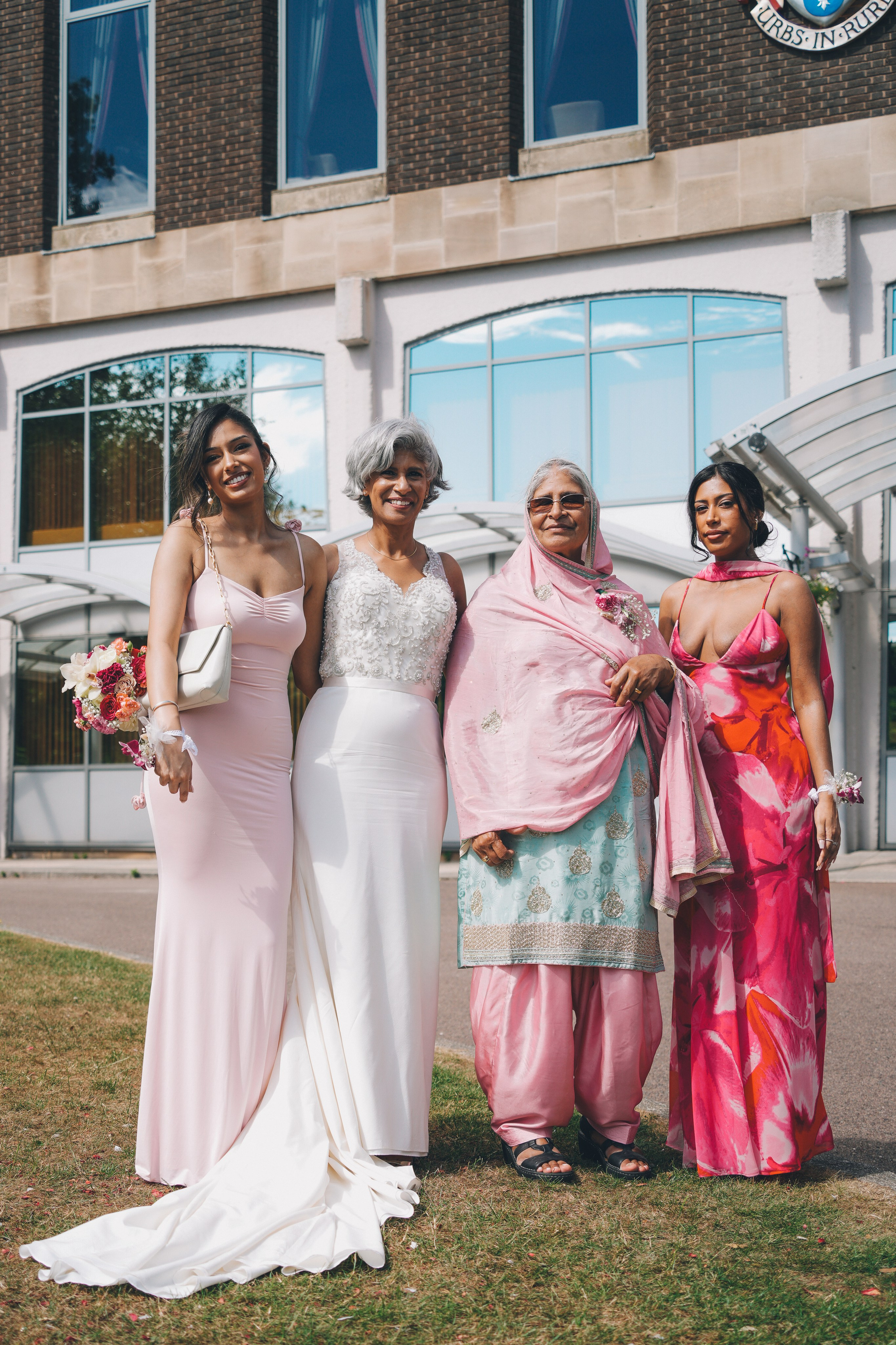 Relaxed family gathering outside Solihull Register Office on wedding day