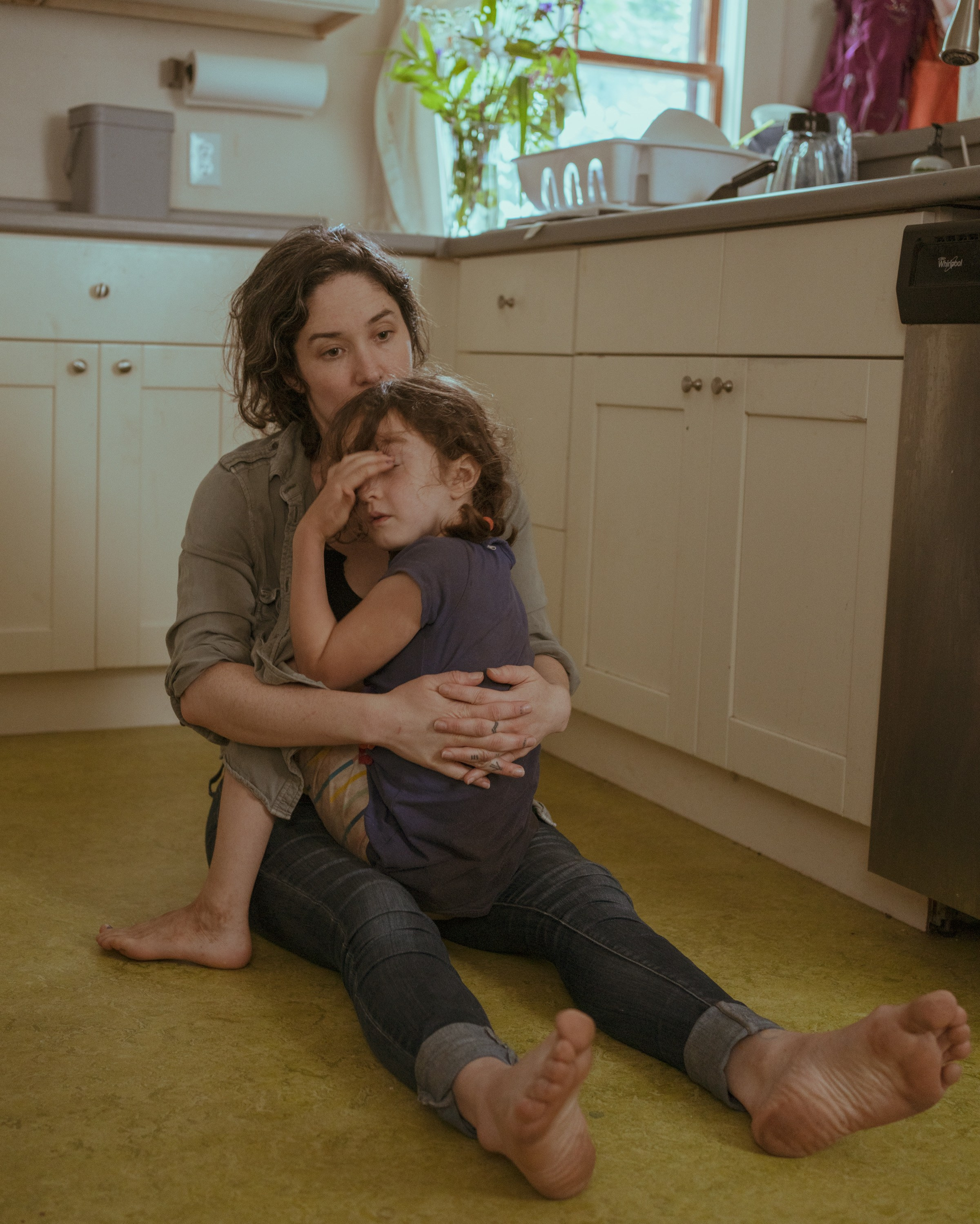 Caitlin is embracing her daughter who she just got home from summer camp. 