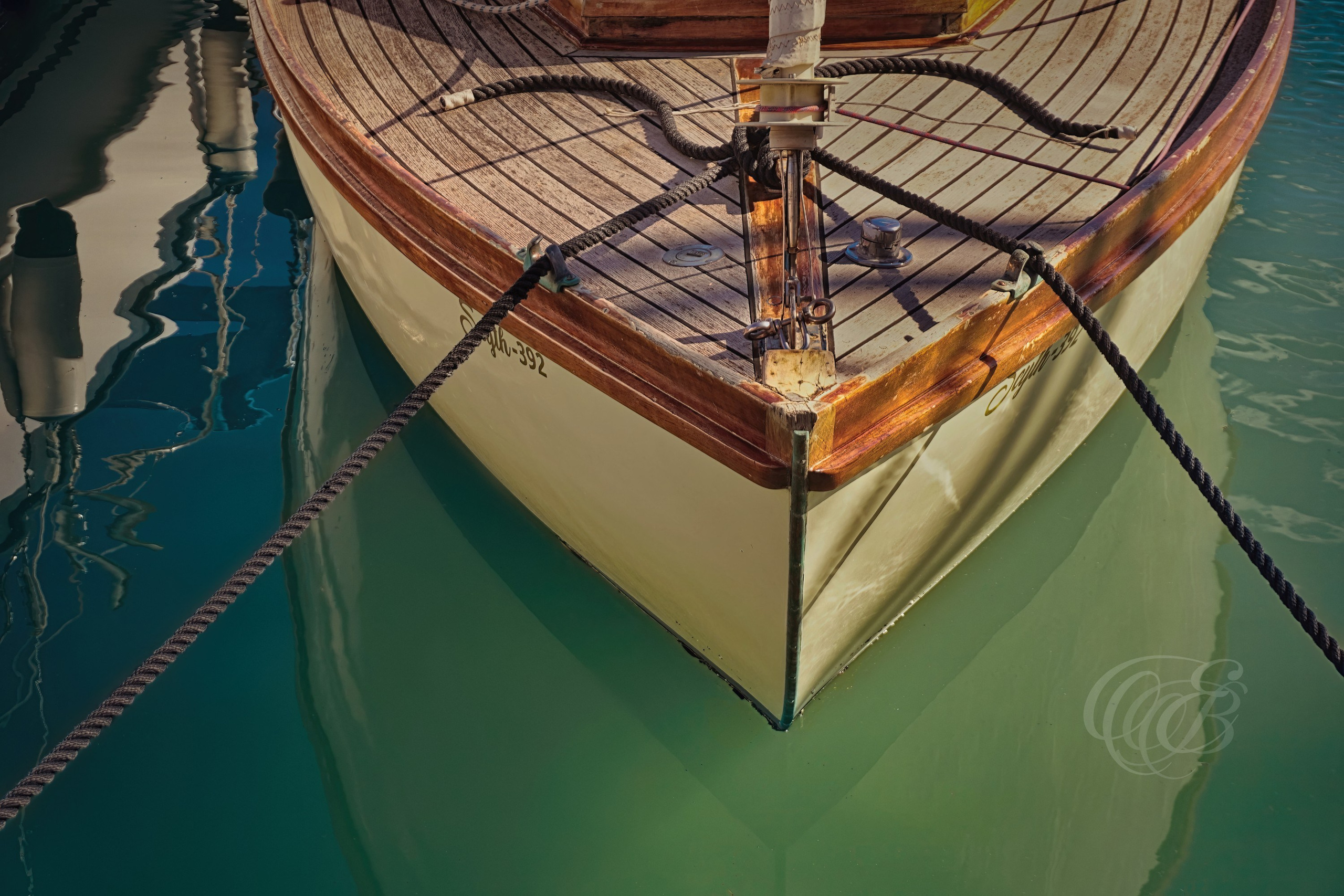 A vintage boat resting among the ports and marinas of Mallorca reflects the island’s enduring connection to Mediterranean navigation and maritime culture. Traditional and classic vessels such as these remain part of the coastal identity of the Balearic Islands, where recreational sailing, fishing, and seafaring traditions continue to shape life along the shoreline. This view captures the timeless character and nautical atmosphere surrounding one of Mallorca’s historic maritime settings. Eduardo Bartoli Photography.
