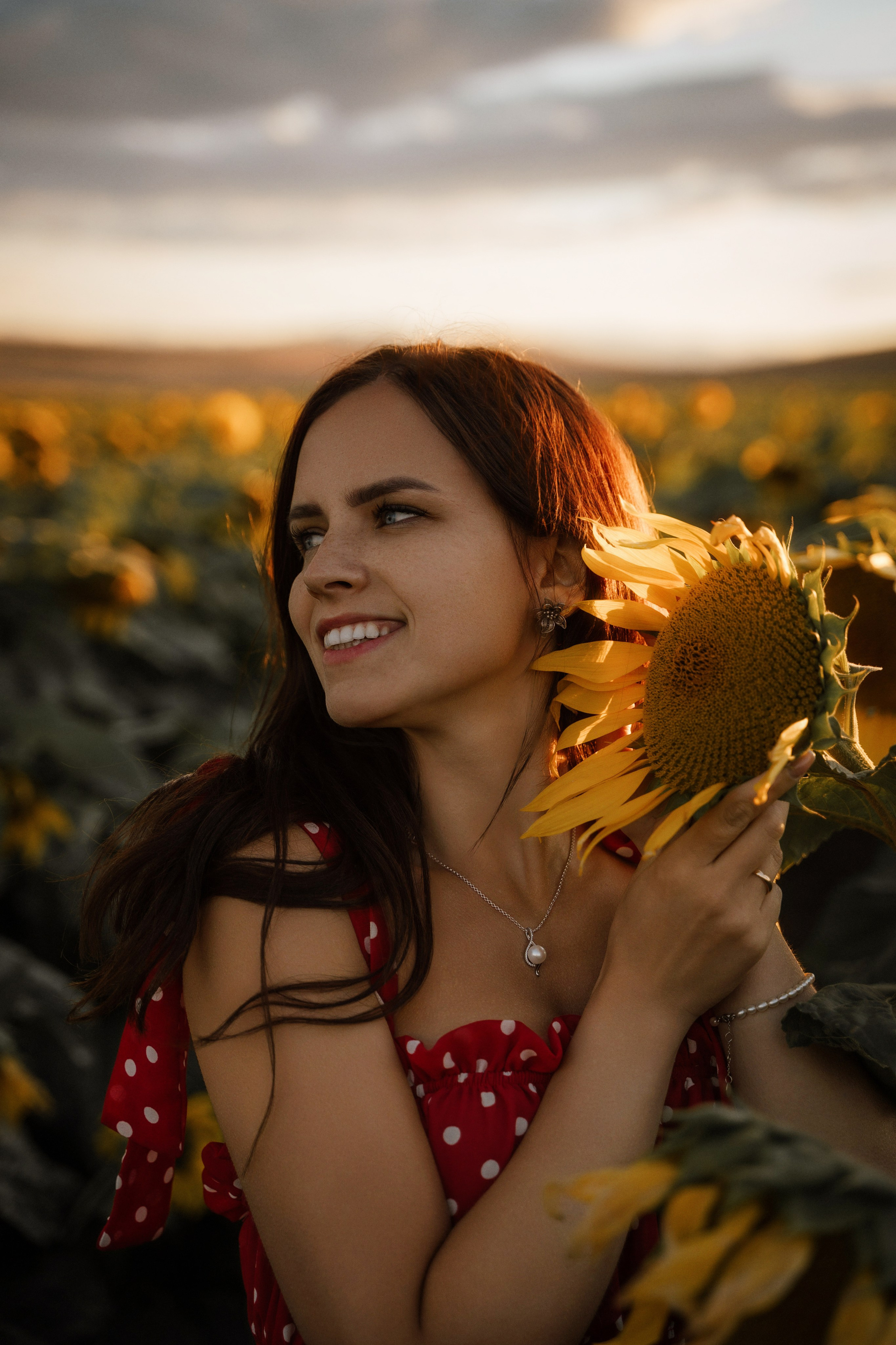 Sunset portrait of female model in sunflower field by Marbella photographer