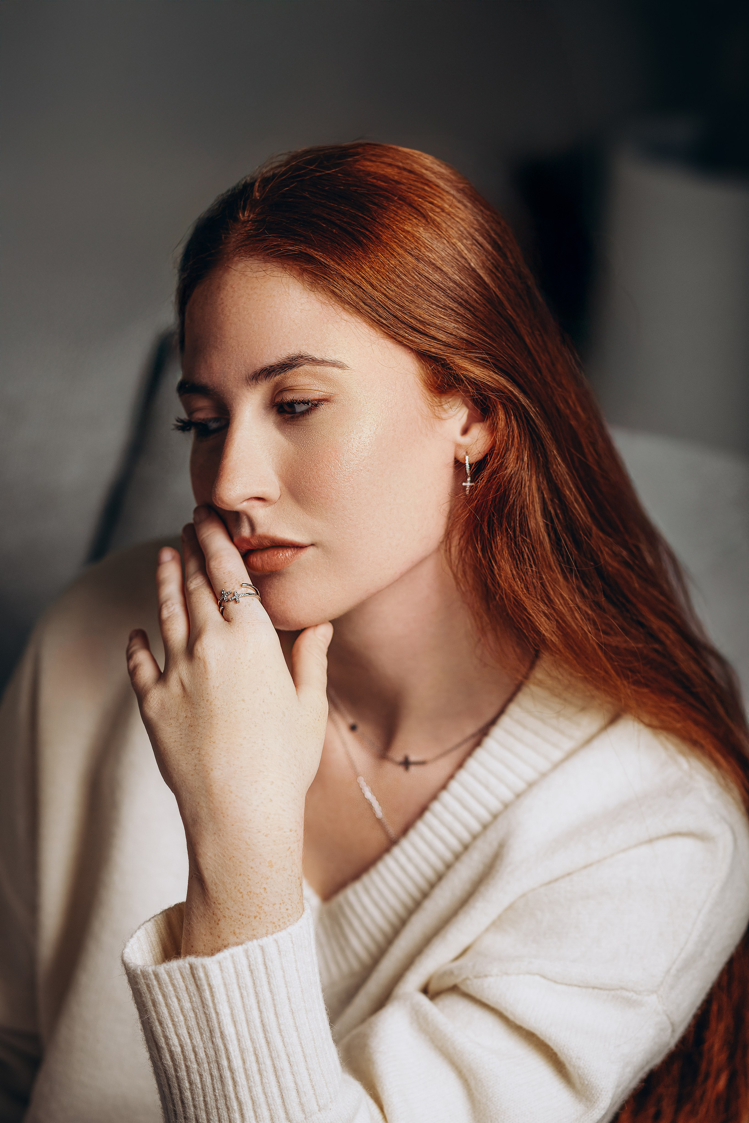 Elegant brand photography portrait captured in Valencia, Spain, showcasing minimalist cross earrings and dainty jewelry. Perfect for businesses searching for refined product, content, or brand photoshoots in Valencia and across Spain.
