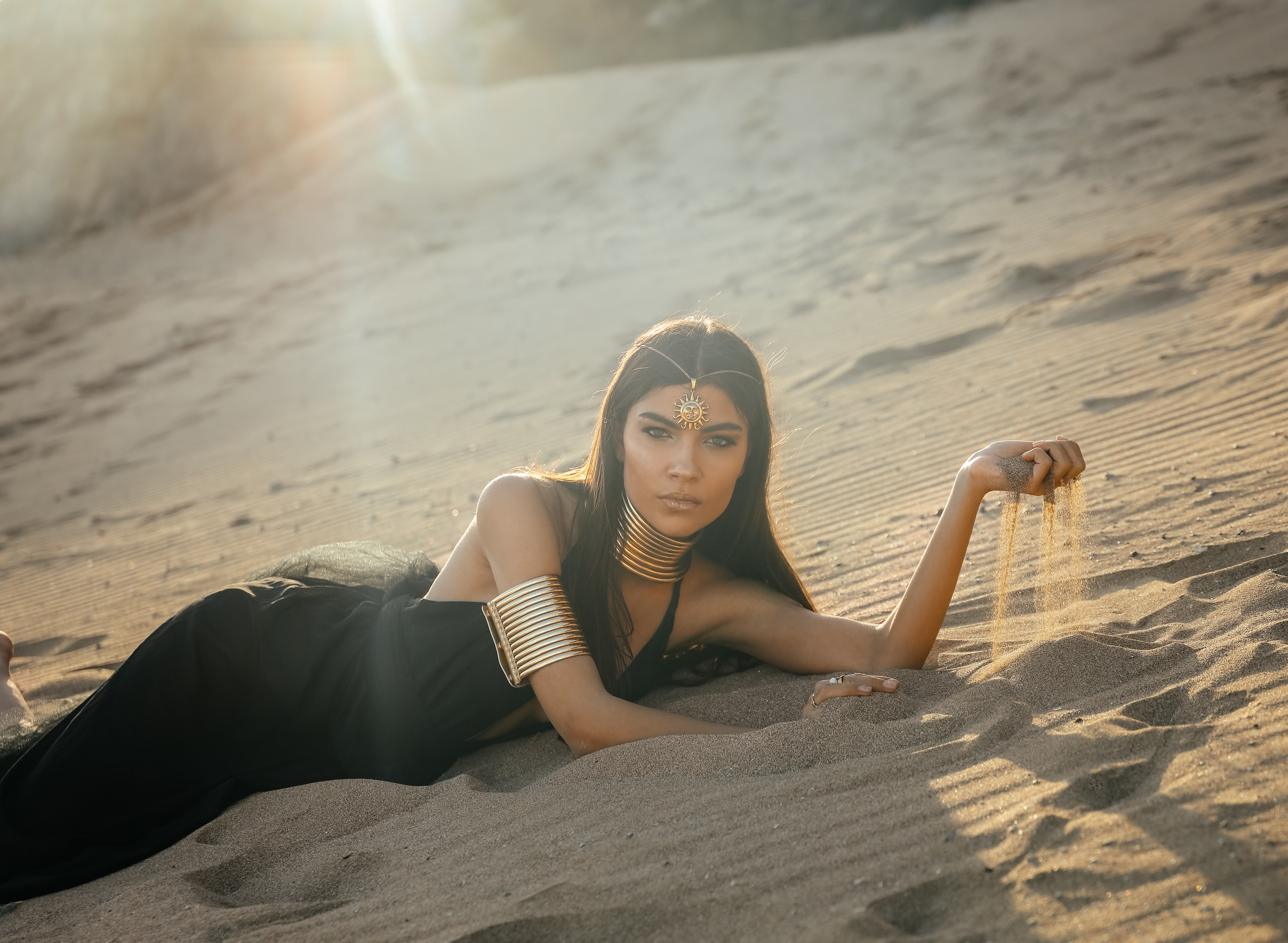 "Silhouette of Solitude: A Black-Clad Beauty in the Desert"