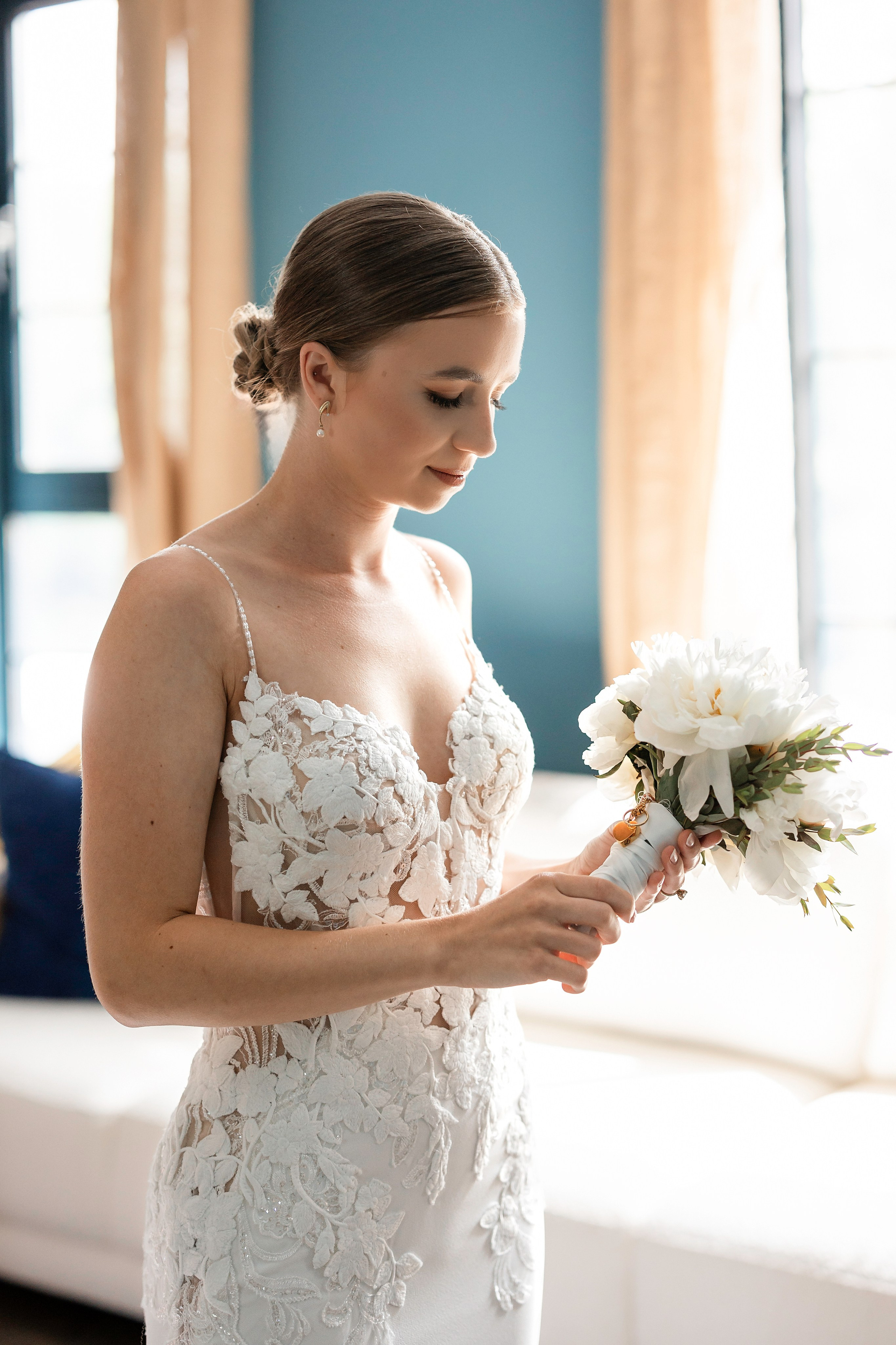 Sophie takes a moment with her mom who passed away looking at her pendants with ashes