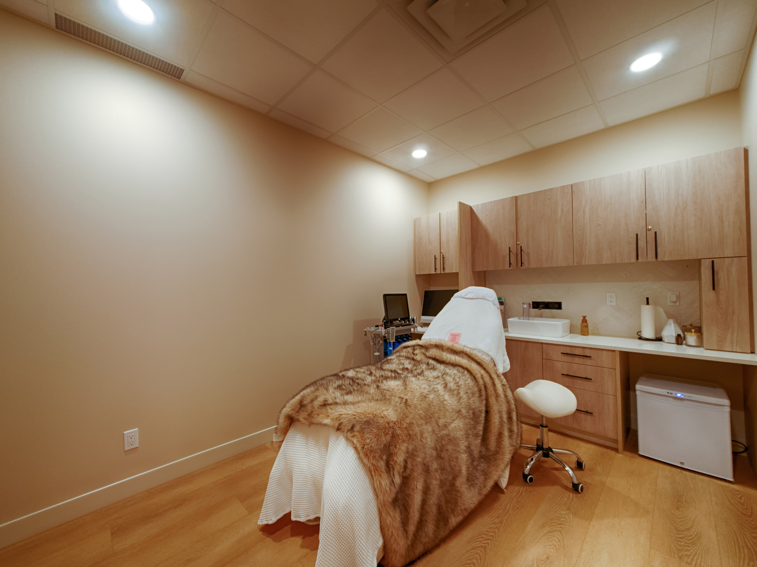 Large treatment room with modern decor.