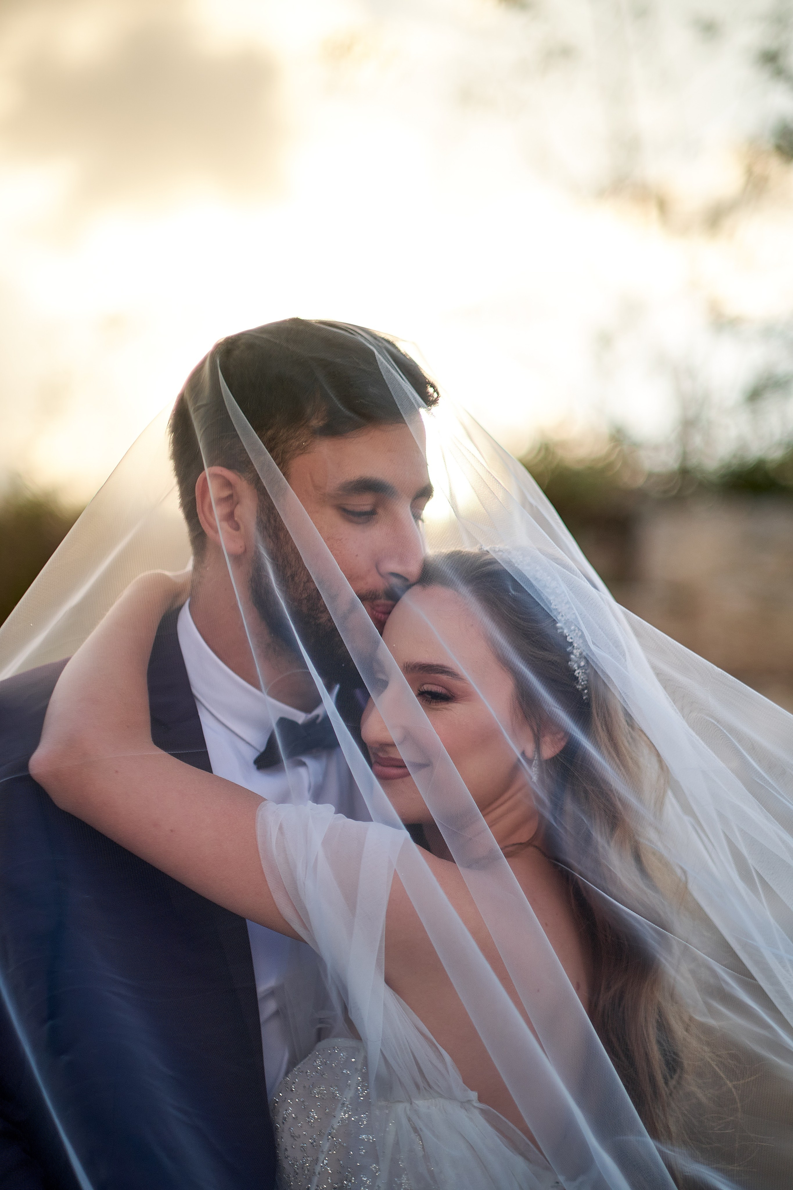 Love Story , wedding Romantic wedding couple portrait, bride with veil and groom in suit, emotional wedding photography by Maxim Polak Israel