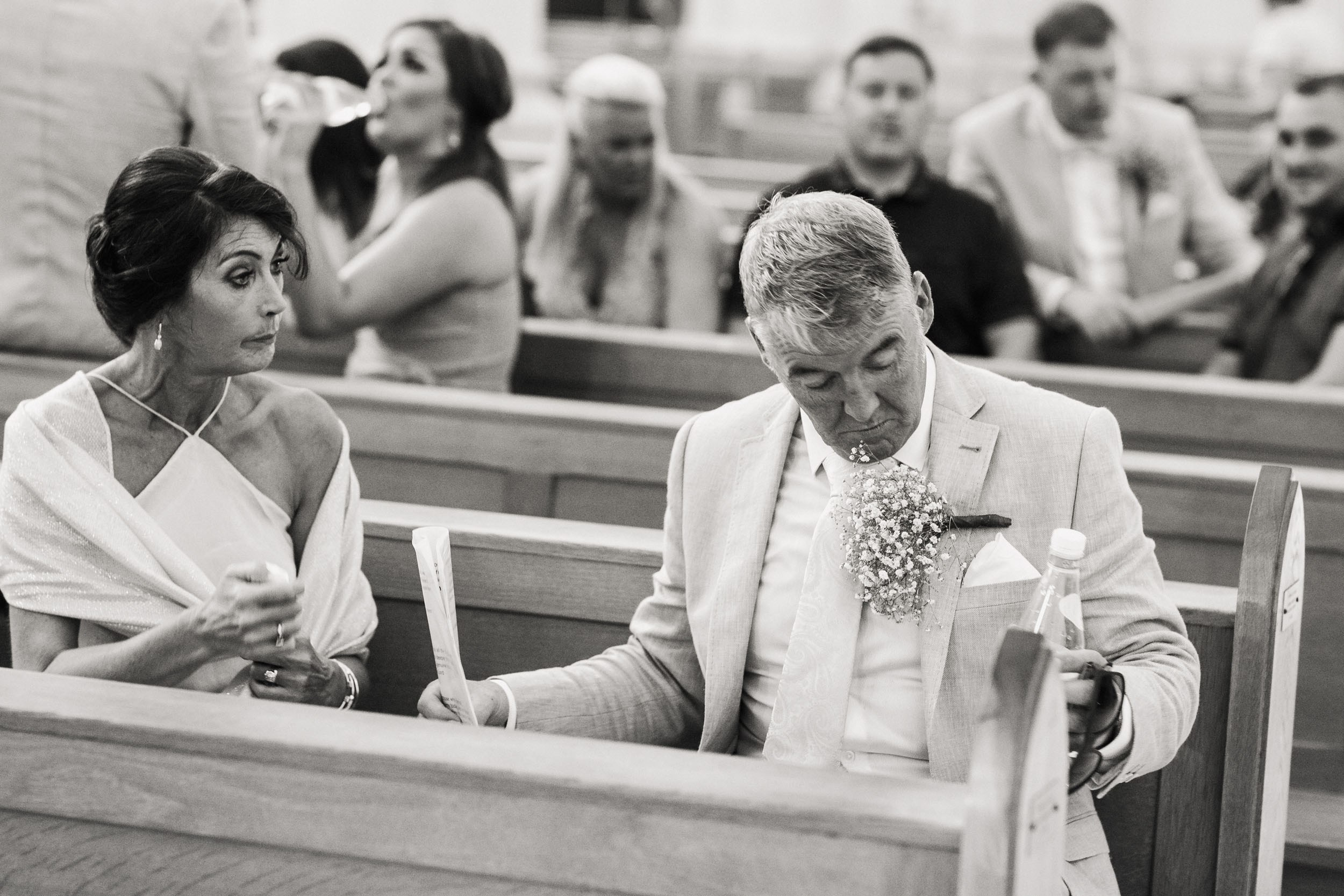 Cute moment of lady looking at her husband's suit that needs to be fixed