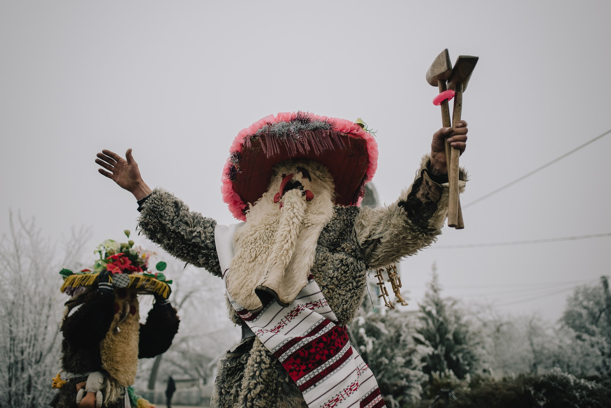 Malanca is a spectacular folk tradition, especially common in the communities of northern Moldova and Bukovina, with deep roots in New Year’s customs. It usually takes place on the night of December 31st to January 1st and marks the transition between years through a blend of folk theater, traditional costumes, music, dance, and humor.Participants – known as malancari – dress up as symbolic characters, often inspired by mythology, history, or rural life: death, the soldier, the bride, the bear, the gypsy, the devil, the old man, and many more. They go from house to house or take part in organized village parades, accompanied by drums, flutes, and distinctive sounds. The message behind it is to chase away evil and attract good fortune, fertility, and abundance in the new year.In some areas, Malanca has evolved into a true display of folk art, with groups preparing costumes, scripts, and music months in advance. It is an authentic way of preserving cultural identity and celebrating community spirit.