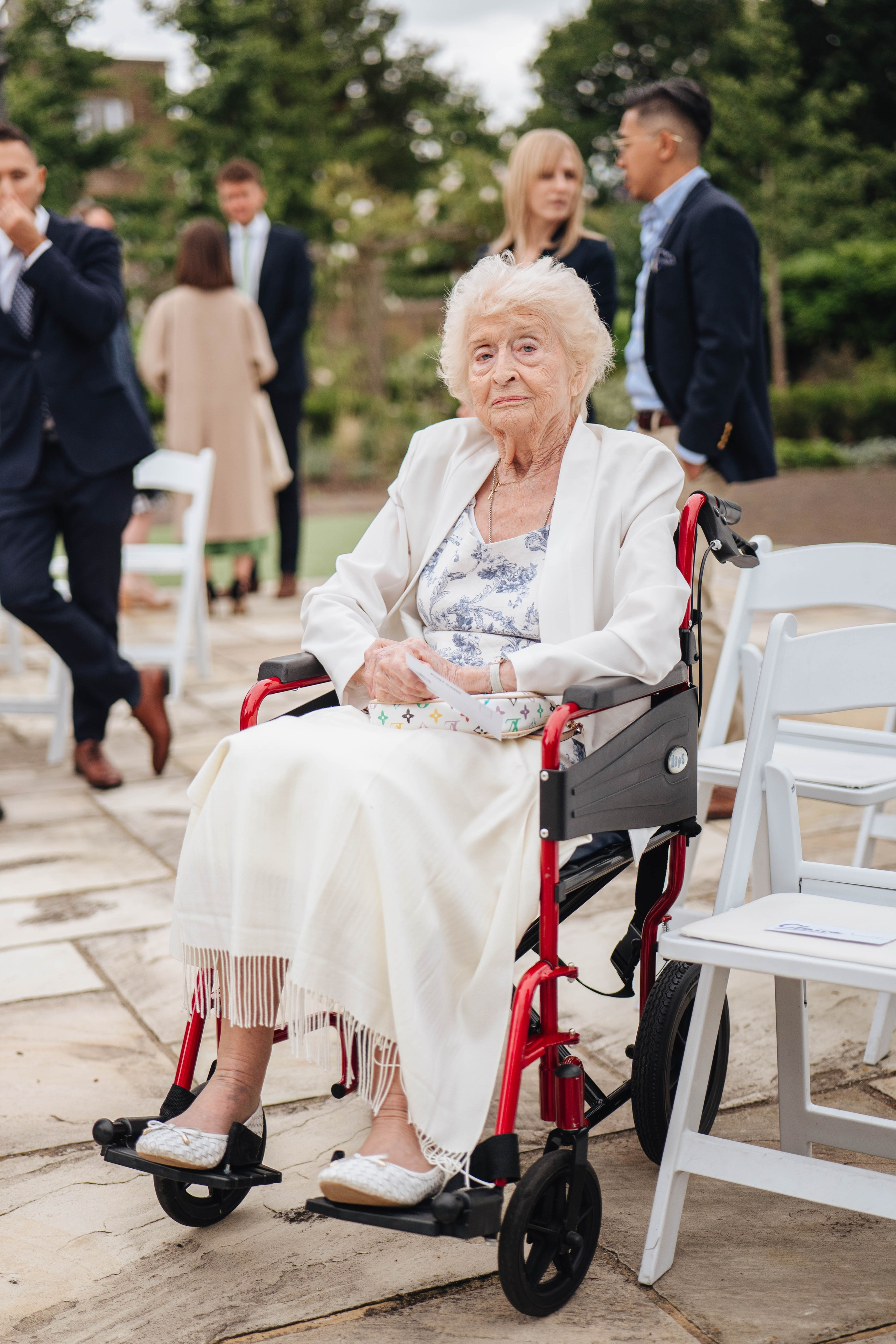 grand mother on wheels waiting for a start of the wedding ceremony