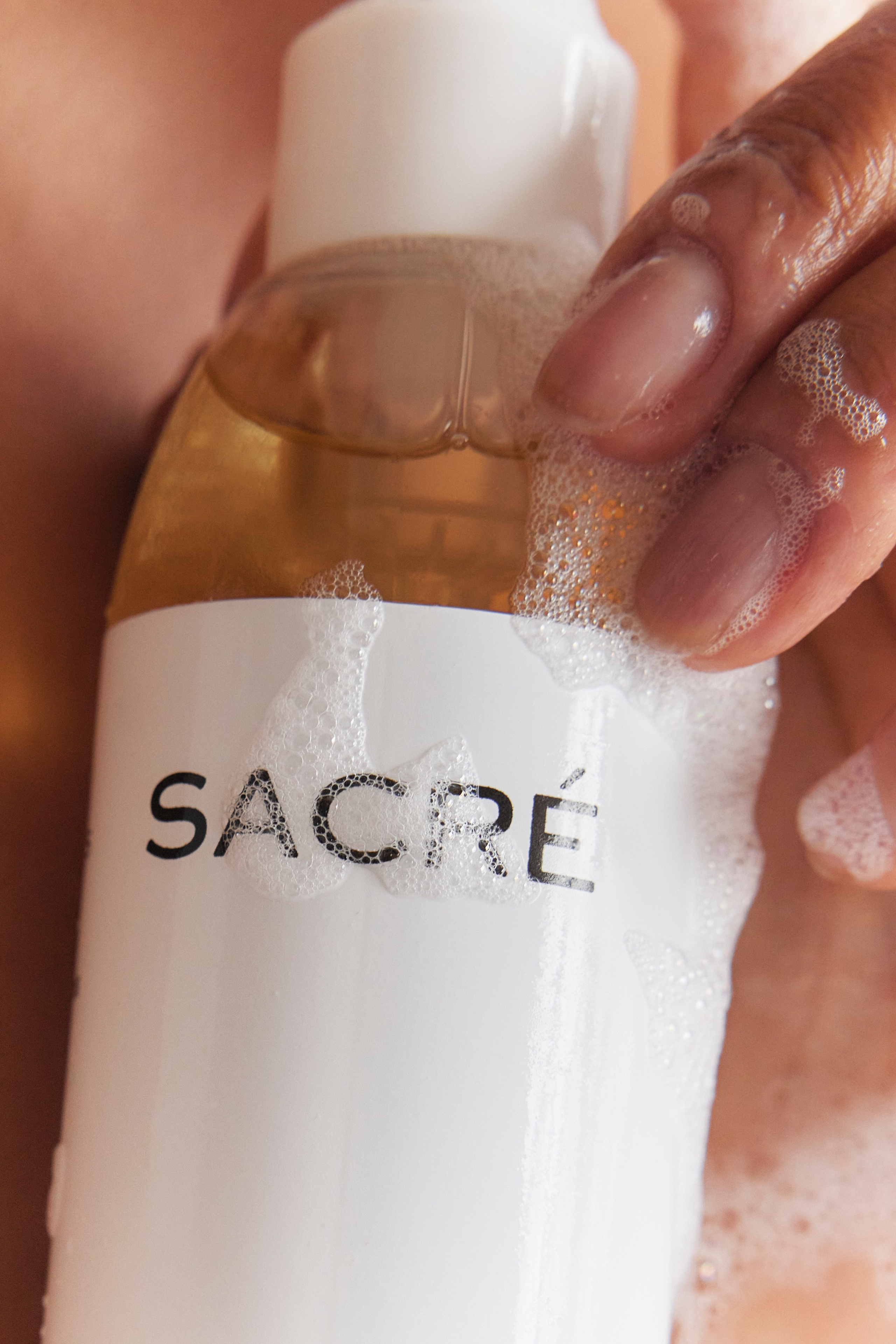 Detailed shot of a skincare product being used, capturing glossy texture and hydration.