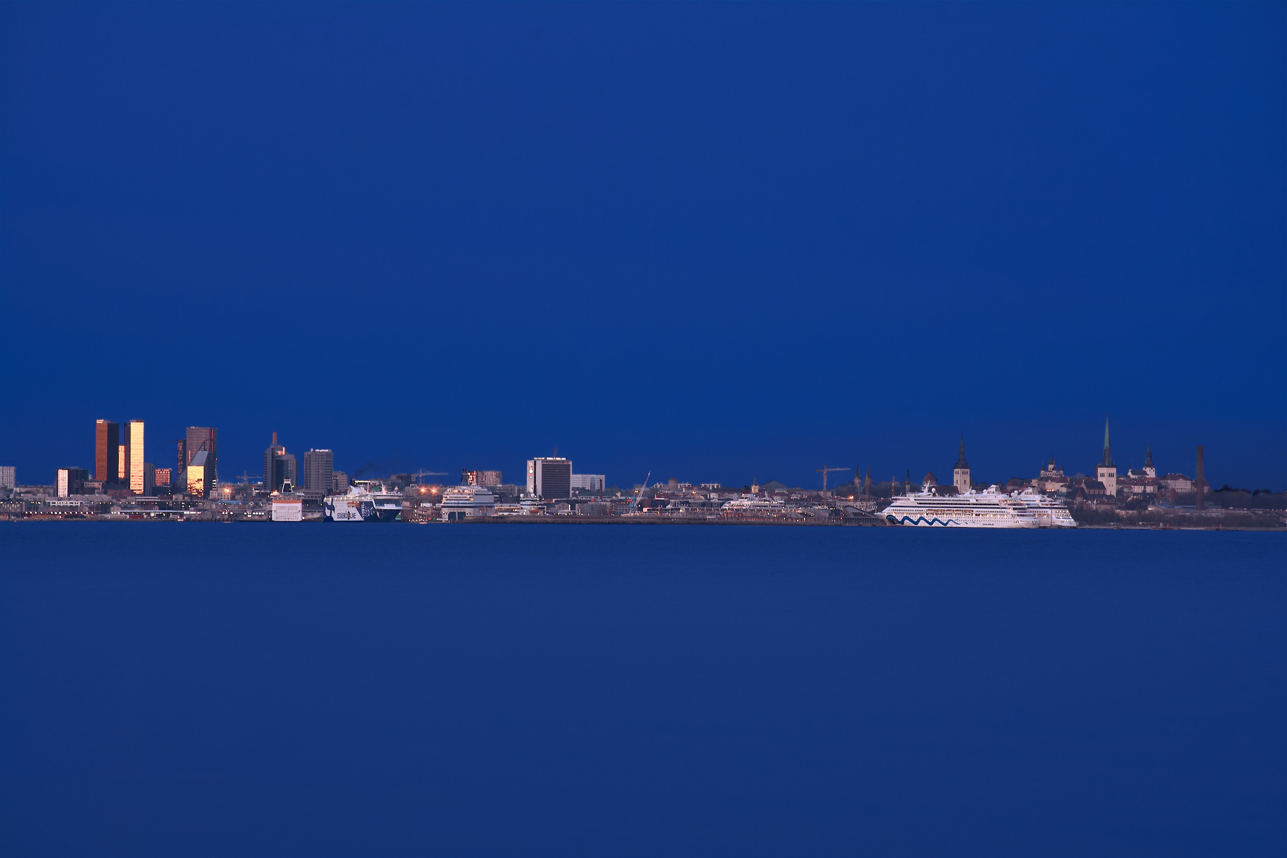 Tallinn old and new skyline at blue hour