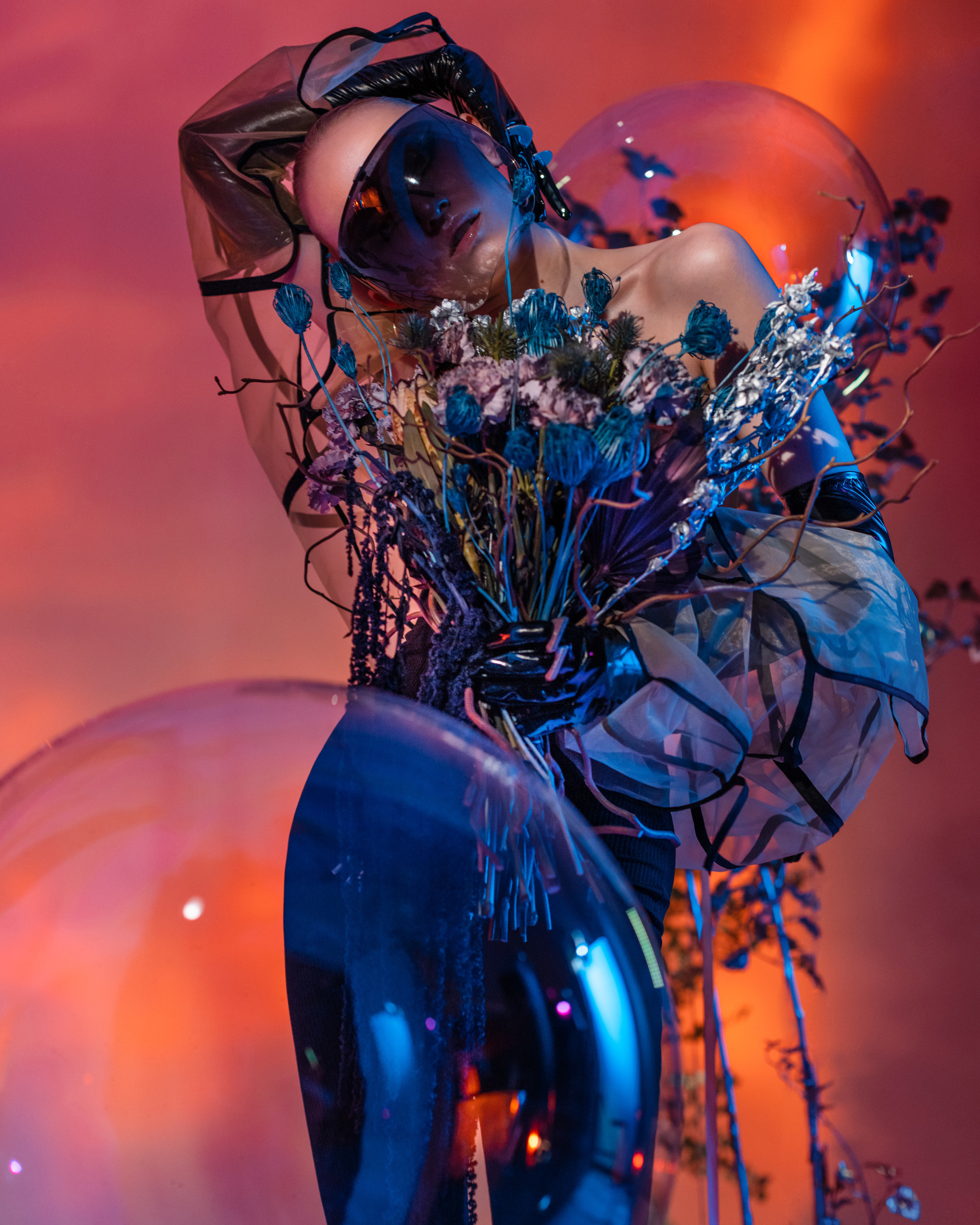  High-fashion studio portrait with innovative lighting techniques and expressive pose, highlighting conceptual artistry.