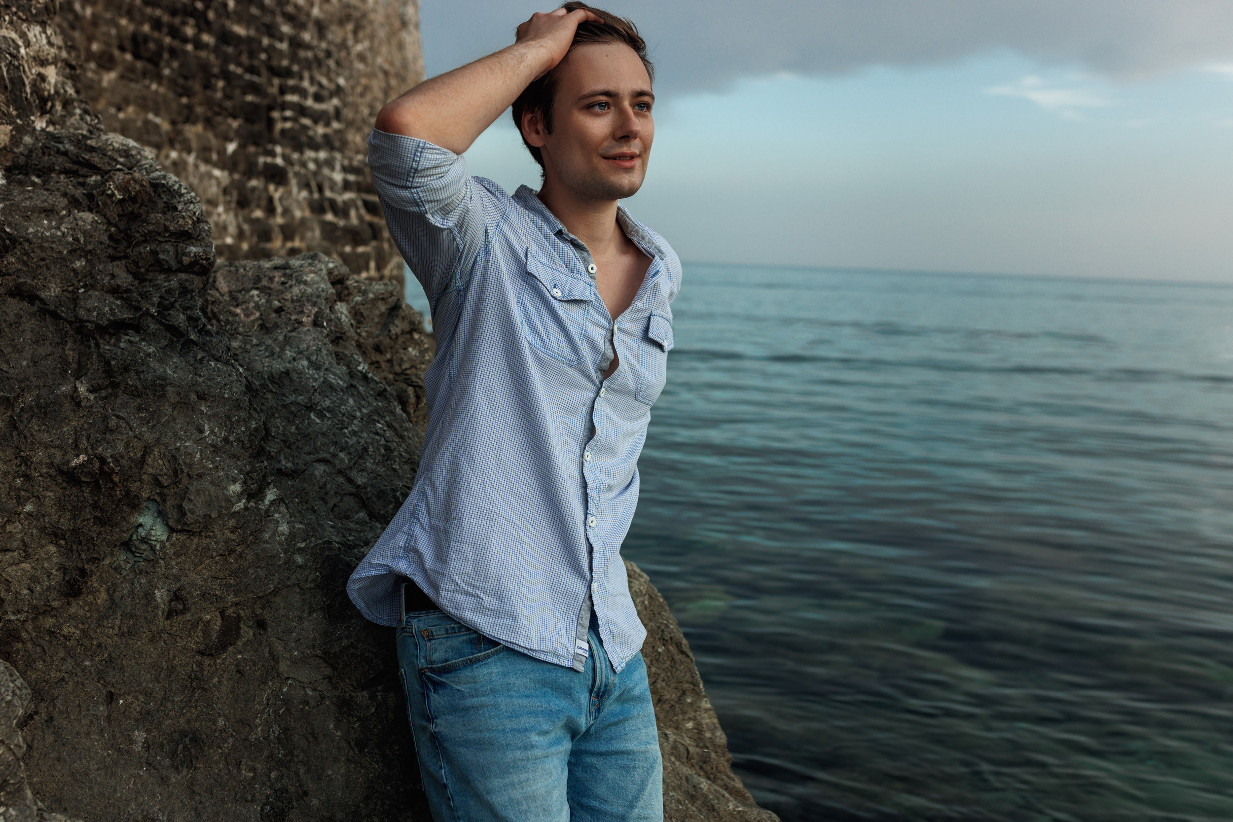 Studio portrait of a man with a thoughtful expression, captured in Brighton.