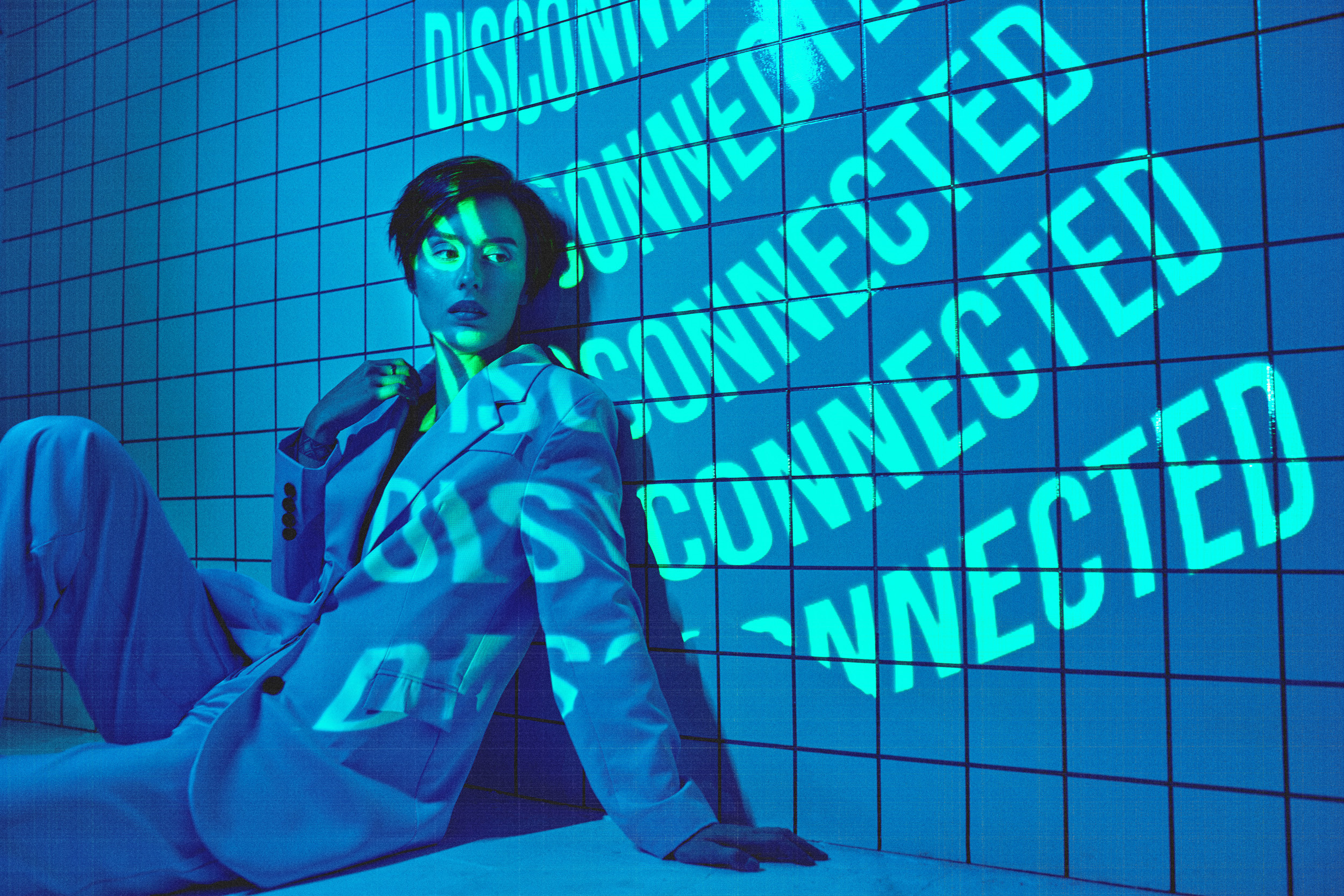 Vibrant editorial photo with layered fashion styling and a focus on individuality and movement.