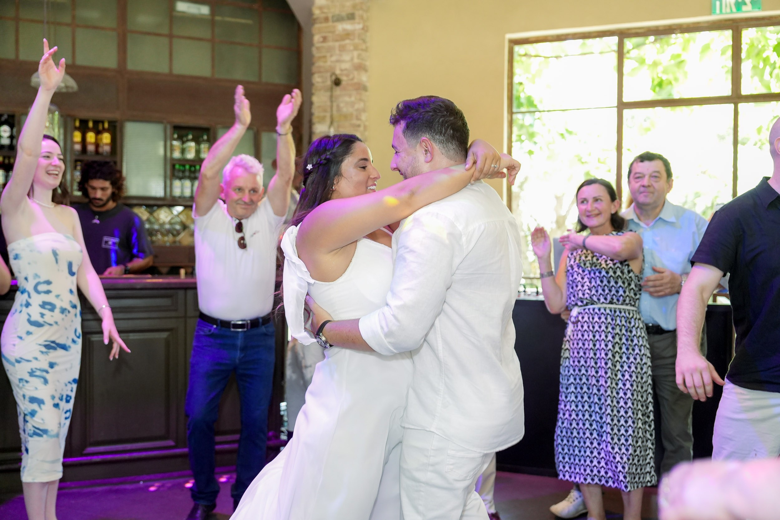 Talia and Ronen dance together during the wedding reception