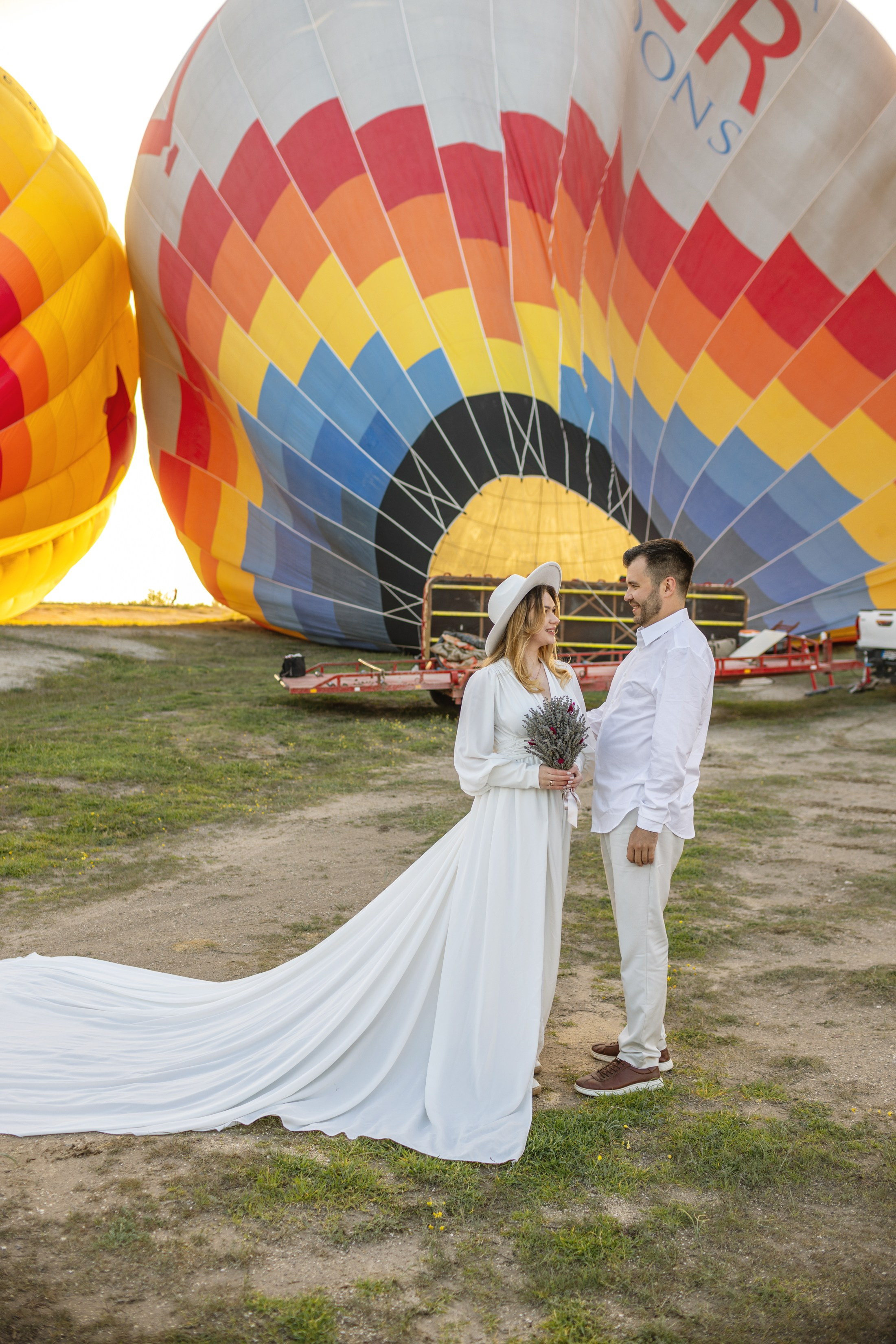 Elegant Wedding Photoshoot with a Flowing Dress and Balloons in Cappadocia. Julia Ganch I Fashion Wedding Photography I Cappadocia Turkey