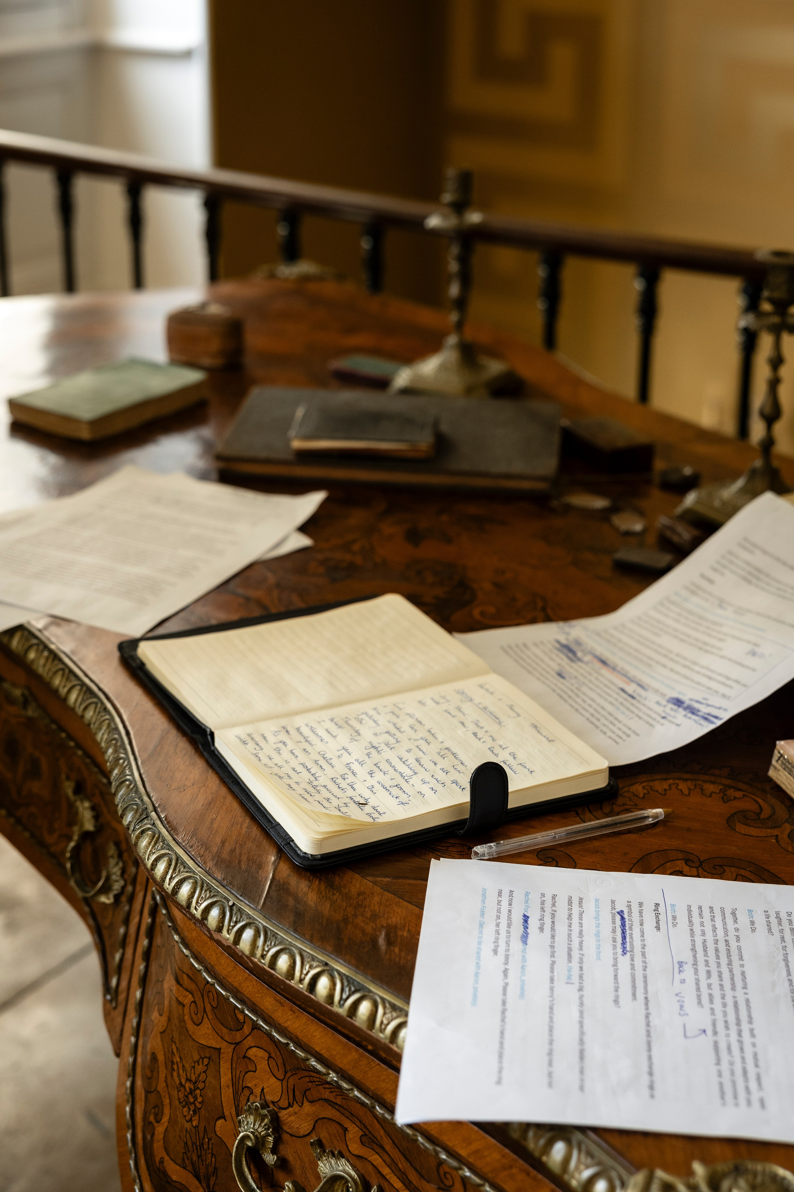 Wedding register and pen waiting on an antique painted table