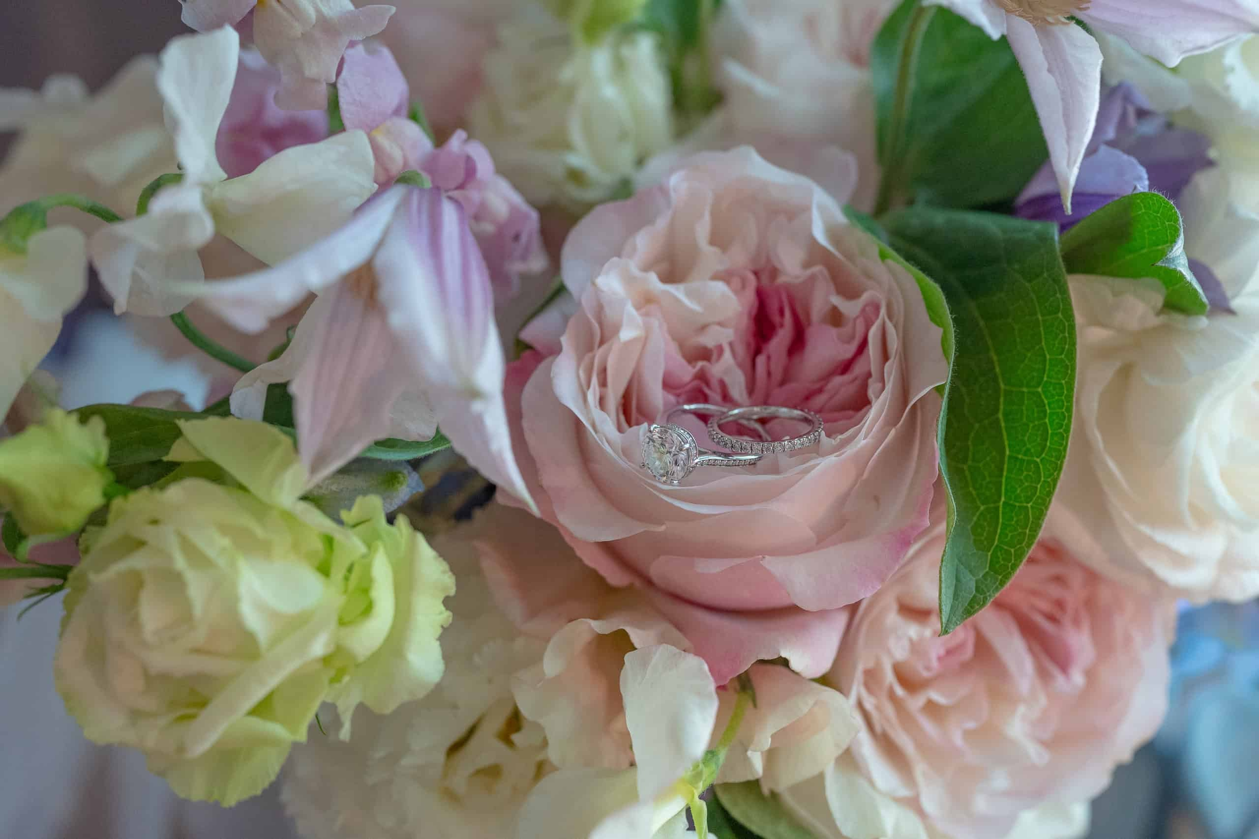 Detail photo of rings in fresh roses and peonies in delicate pink and blush tones bridal bouquet