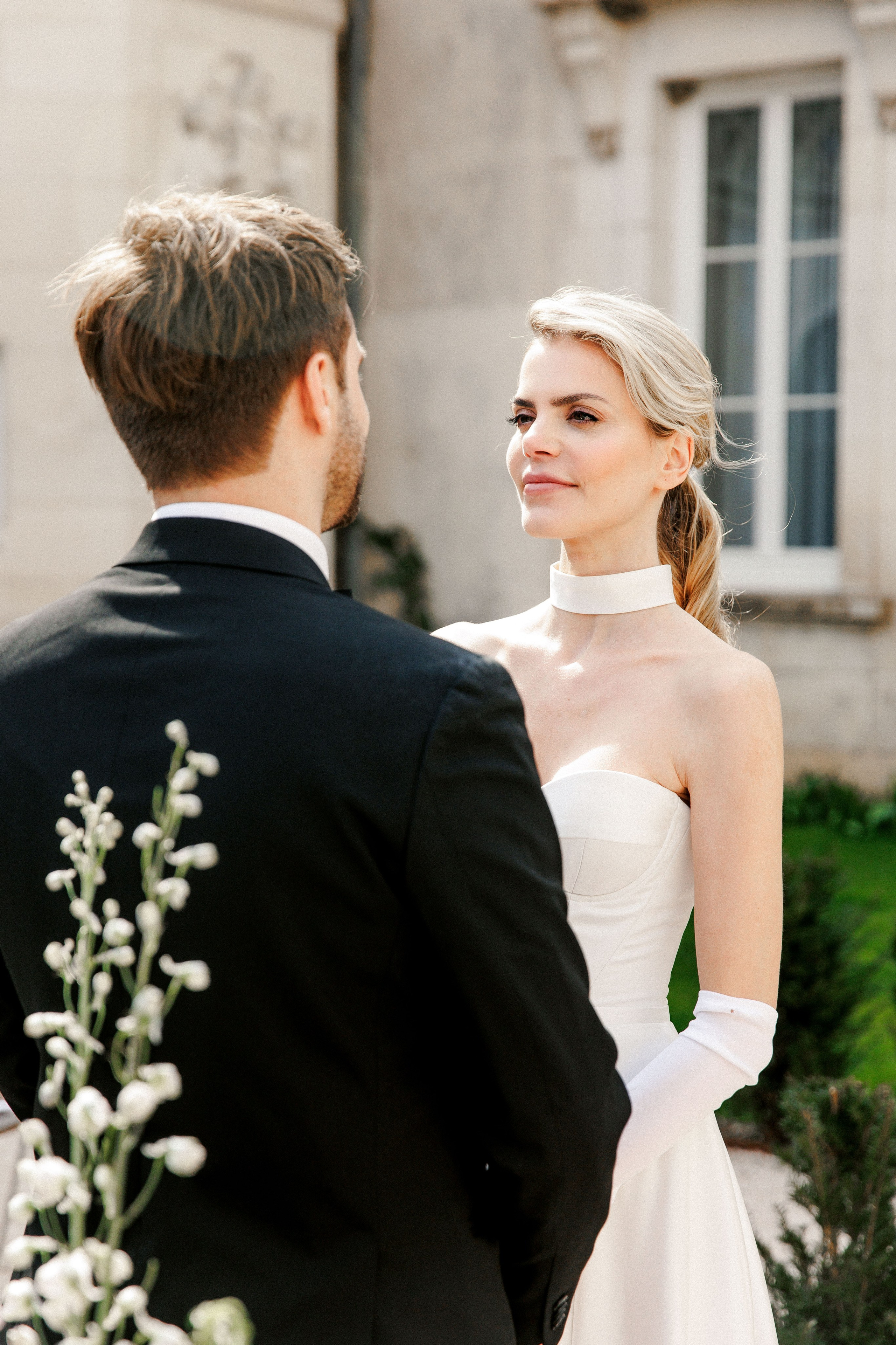 Intimate moment of the bride and groom sharing their love during their wedding ceremony in France. 