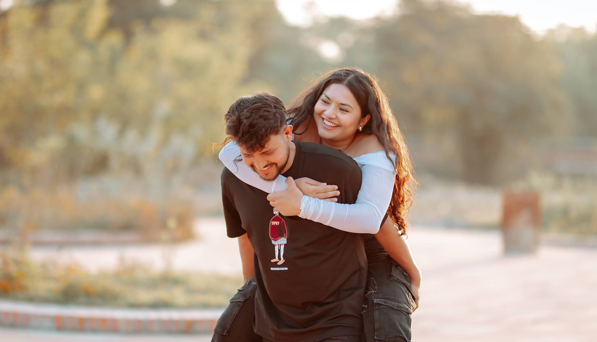 Couple enjoying a piggyback ride during pre-wedding photoshoot in Nepal.