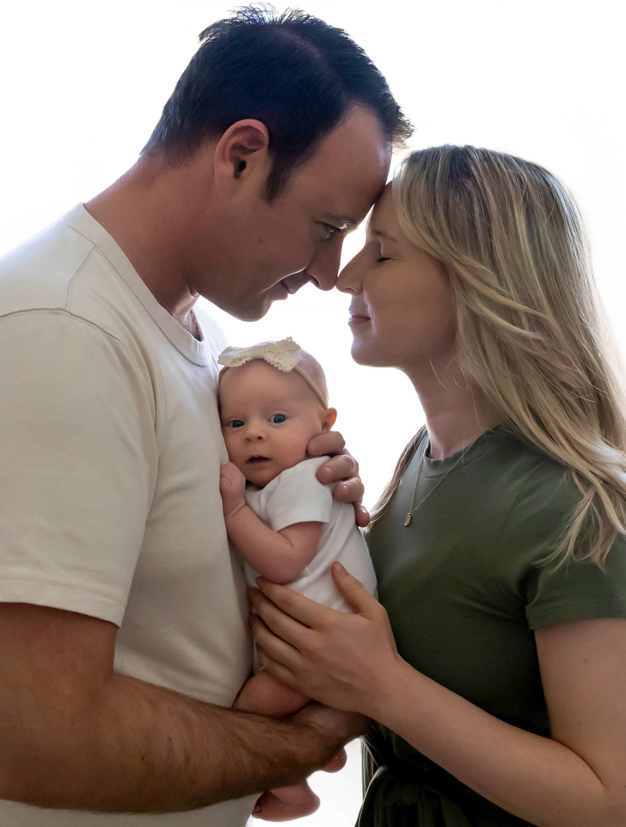 family photo with newborn in contrast light