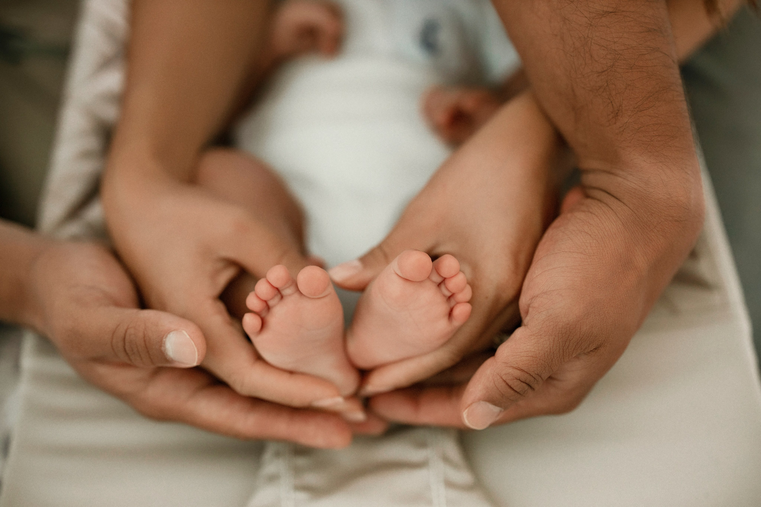 New parents bonding with baby in lifestyle photography
