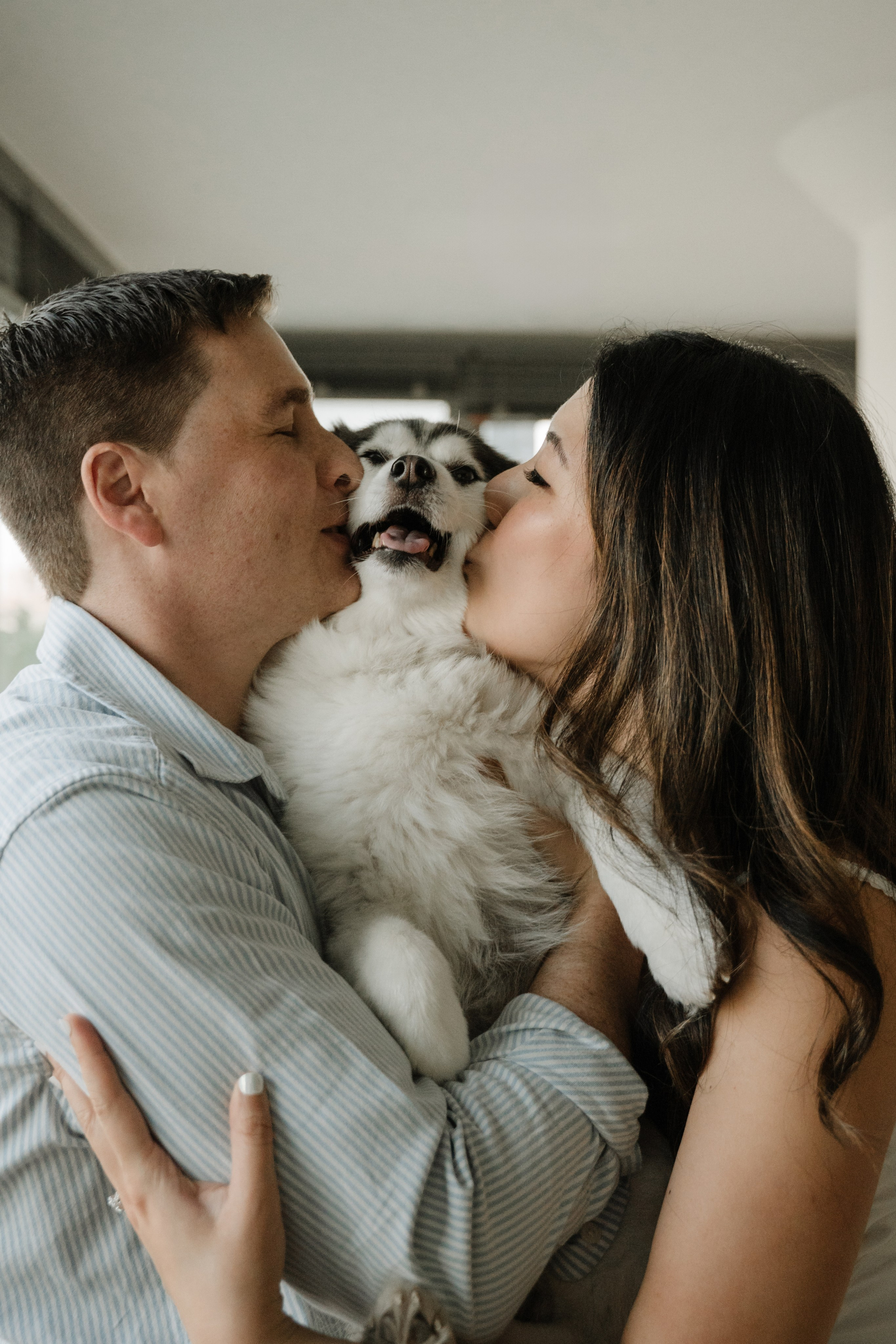 An adorable couple with their dog. Portrait and wedding photographer in New York