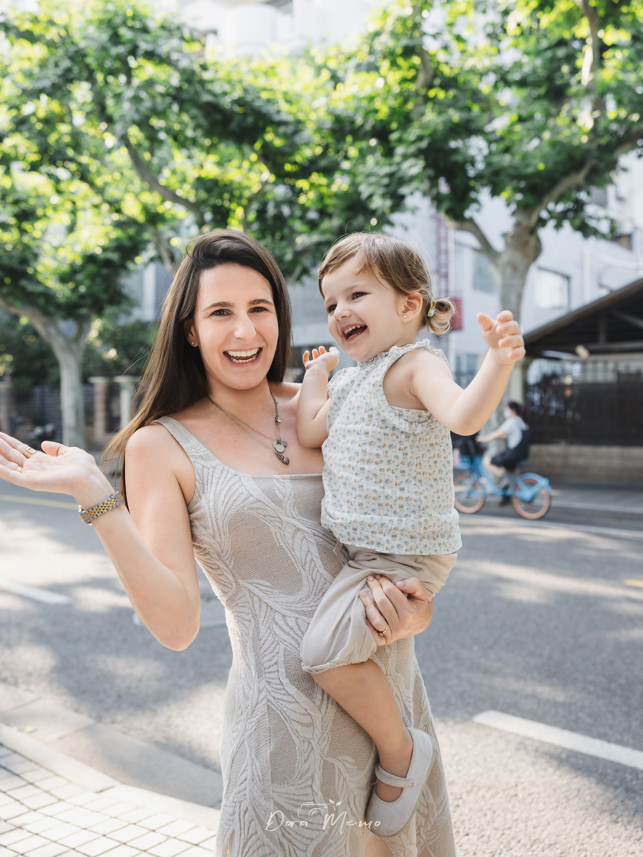 Mom and daughter smiling at each other | Mother and daughter sharing a bright smile, natural family photography