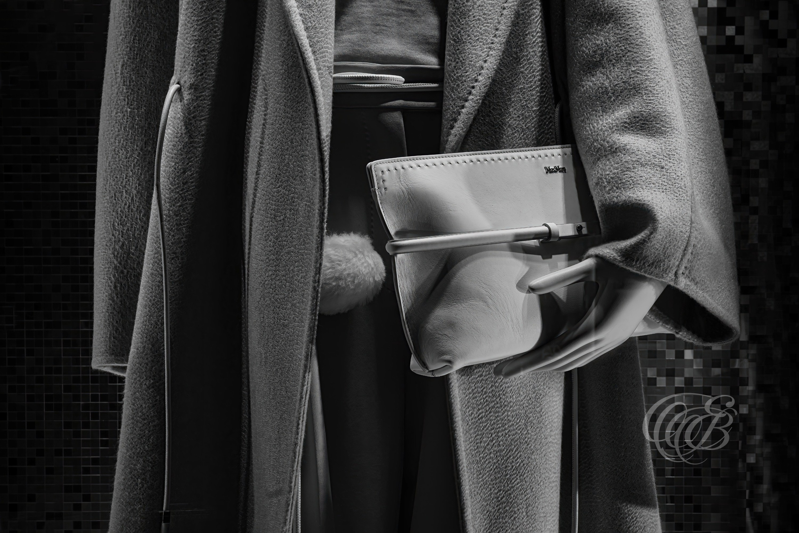 Rome Italy – Max Mara Bag - Window Display B&W – Eduardo Bartoli Fine Art Photography - Black and white fine art photograph of a mannequin’s hand holding a bag in the Max Mara window display in Rome, Italy – photography by Eduardo Bartoli.